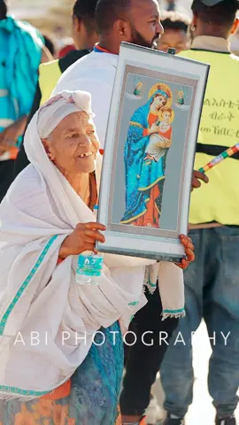 A beautiful moment of faith and devotion during the celebration of Epiphany here in Tigray. This elderly woman holds a picture of Saint Mary, symbolizing her unwavering faith and connection to our traditions. Moments like these remind us of the strength and beauty of our heritage, passed down through generations. 💙✨ #Epiphany #TigrayCulture #FaithAndHeritage #Ethiopia #TraditionLivesOn 