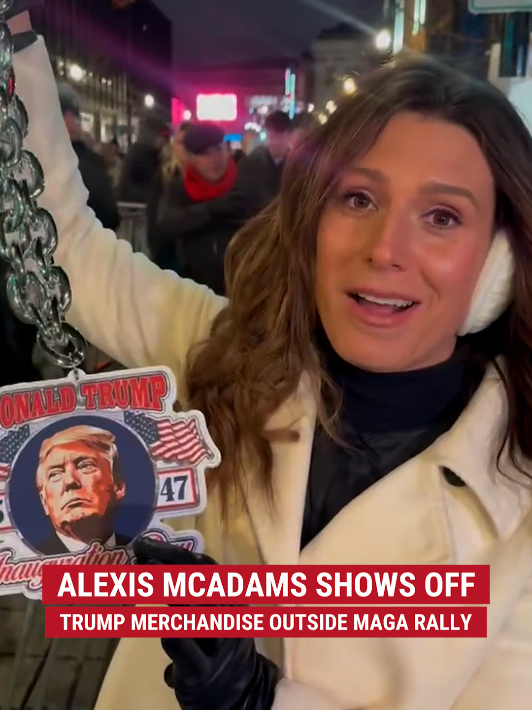 Alexis McAdams shows off some of the merchandise being sold outside the Make America Great Again Victory Rally in D.C. on the night before Trump's inauguration.