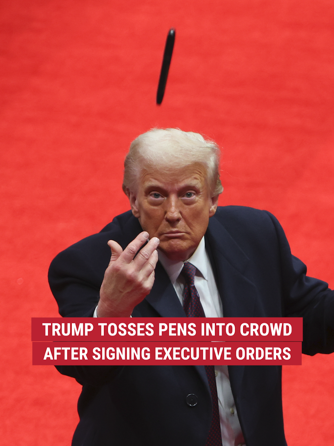 President Trump tosses pens into the crowd after signing executive orders at his inaugural parade, marking his first actions as president.