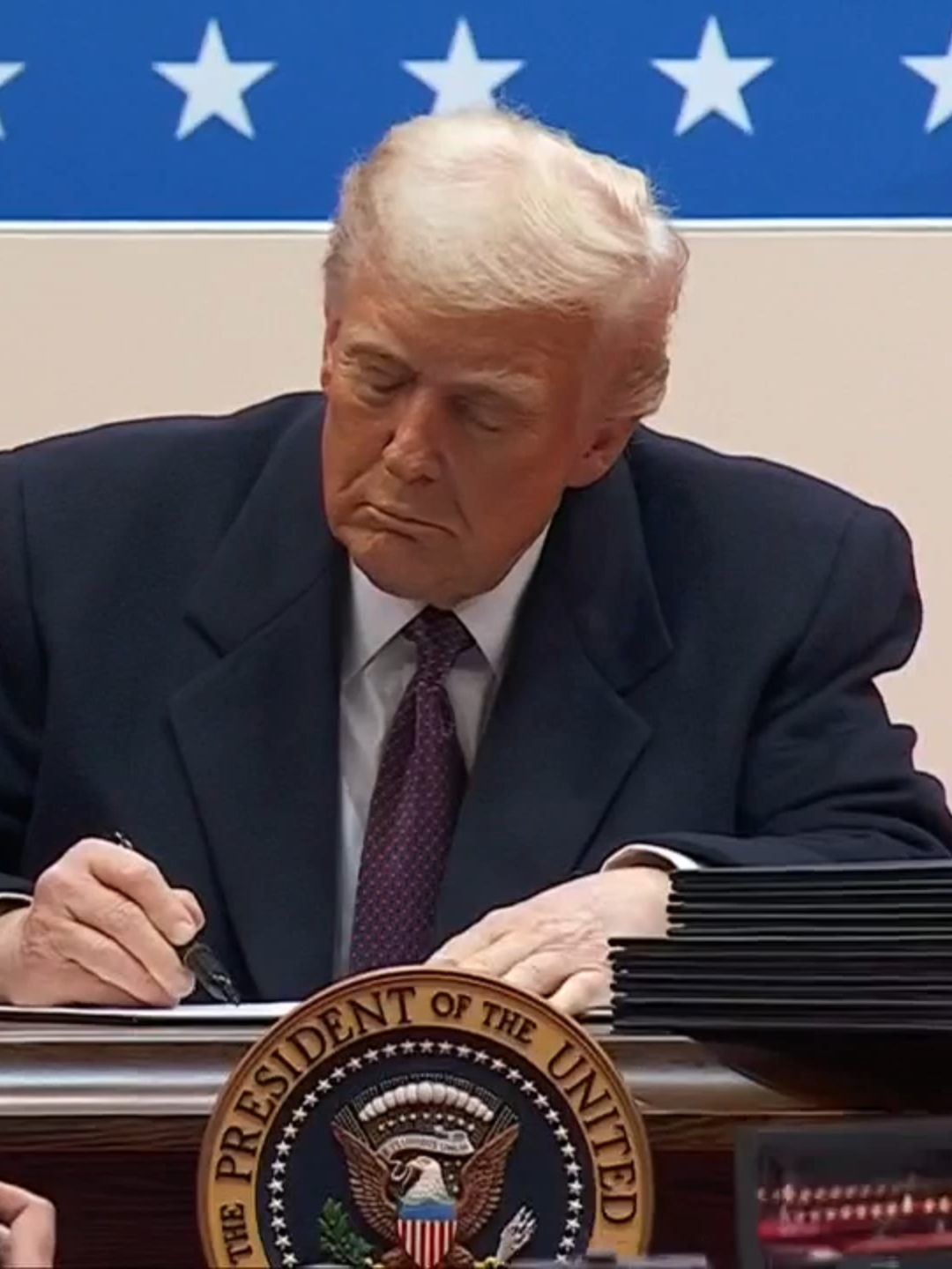 President Trump signs eight executive orders at his inaugural parade.