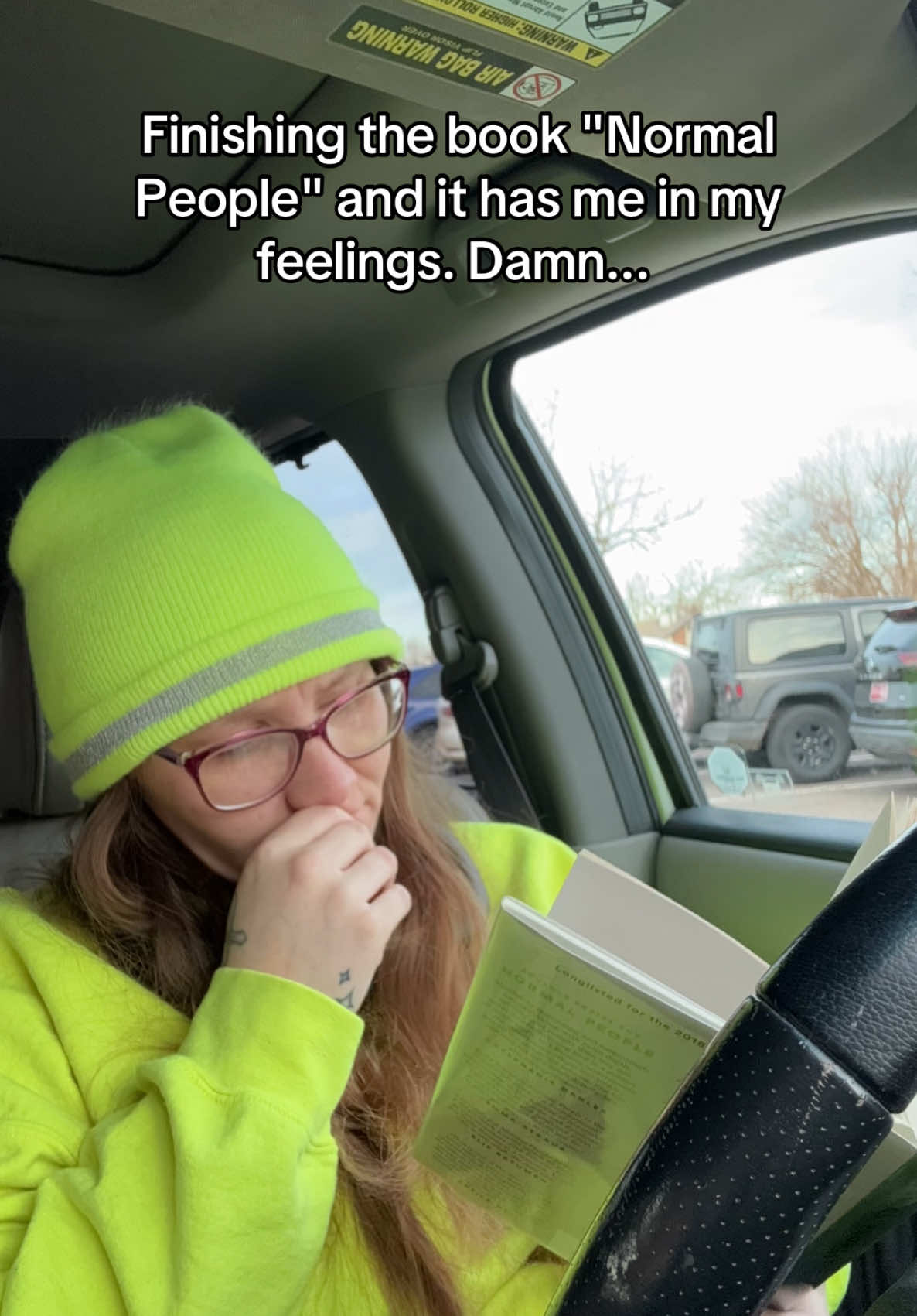 It's a must read!! It is Normal People by Sally Rooney. It is good! Video Description: The video text says "Finishing the book Normal People and it has me in my feelings. Damn.." Reading a book in the car. The video speed is in a Timelapse. #BookTok #books