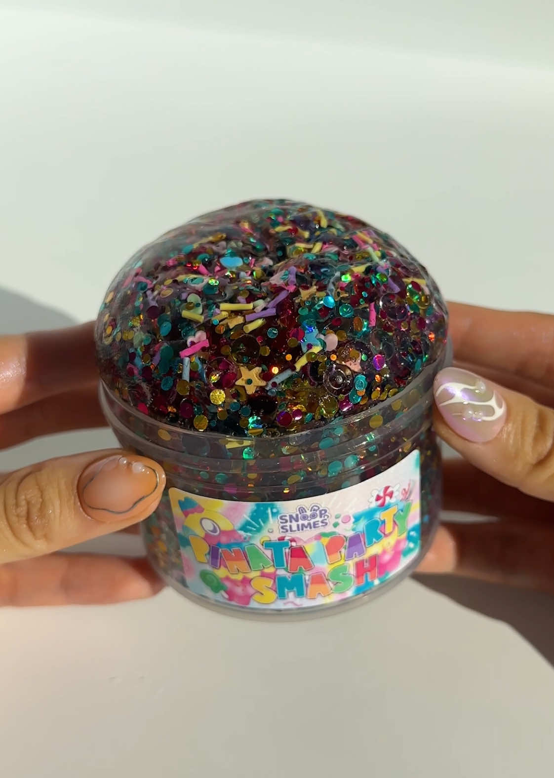 Pinata Party Smash 🪅 It is packed with fishbowl beads, multicolored glitter, and party-themed sprinkles ~ remove a little slime + squish slowly to get the best crumbly and crunchy ASMR! #pinata #slime #asmr 