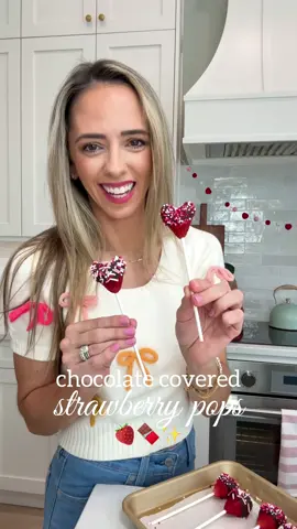 Chocolate Covered Strawberry Pops! 🍫 So cute for a special Valentines treat!  What You’ll Need: * Fresh strawberries   * Lollipop sticks or wooden skewers * Your favorite chocolate (milk, dark, or white—your choice!) * Sprinkles for that extra pop of color (optional!) * A parchment paper-lined tray for setting Instructions: 1. Prep the Strawberries: Gently wash and dry your strawberries, leaving the green leaves attached for easy handling. 2. Melt the Chocolate: Slowly melt your chocolate of choice over a double boiler or in the microwave in 30-second intervals, stirring in between to avoid burning. 3. Attach the Sticks: Insert the lollipop sticks into the base of each strawberry, making sure they’re secure. 4. Cut the tops of your strawberries in a “V” to form a heart shape. 5. Dip & Decorate: Dip the top half of each strawberry into the melted chocolate, tapping off the excess. Before the chocolate sets, sprinkle with your choice of sprinkles or edible glitter for a festive flair. 6. Set the Chocolate: Lay the dipped strawberries on the parchment paper and let them set at room temperature, or chill them in the fridge for about 15-20 minutes for quicker results. 7. Storage: Once set, store your chocolate-covered strawberries in an airtight container, layering them between parchment paper to avoid them sticking. They stay fresh for up to 2-3 days! #valentinestreats #easydessert #easybaking #chocolatecoveredstrawberries #momhacks #sahm 