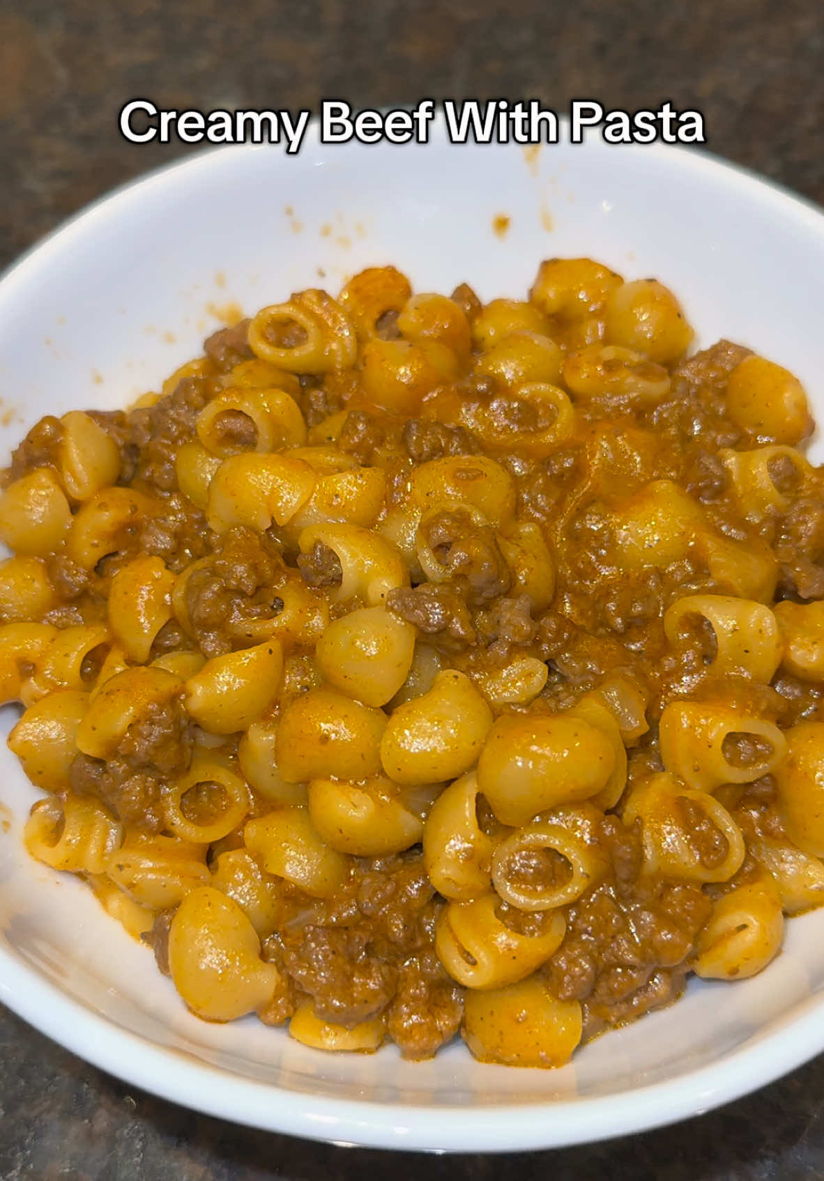 Creamy Beef With Pasta Shells is TOO YUMMY 🍝  - 1 Pound of Beef - Olive Oil - Chopped Onions - Garlic - Tomato Paste - Beef Broth - Seasonings of your choice (salt pepper garlic paprika Italian seasoning crushed red pepper) - Pasta - Heavy cream or alternative   - Cheddar Cheese #beefpasta #beefrecipe 