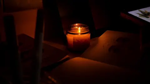 In the gentle flicker of the candles, she seeks peace - - -  #cinematography #videography #fypシ゚ #cinematic #aesthetic 