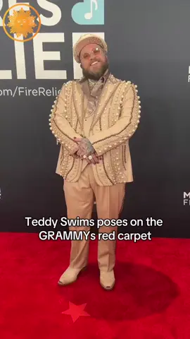 #TeddySwims, who is up for his first-ever award at the #GRAMMYs, walks the red carpet with his partner 💕