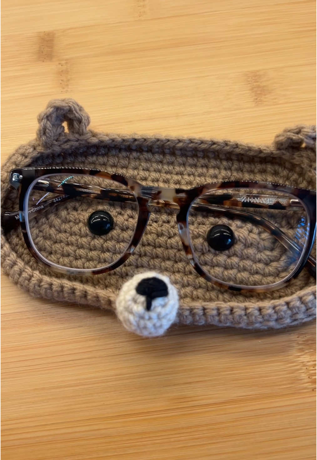 Not a care bear. 🤎  Pattern by AkumuNightmare and inspired by Cosmic Mage’s finished project. Sooo cute and fun; thanks guys!! #crochetglassesholder #crochetbear #cutecrochet #easycrochet #crochetersoftiktok 