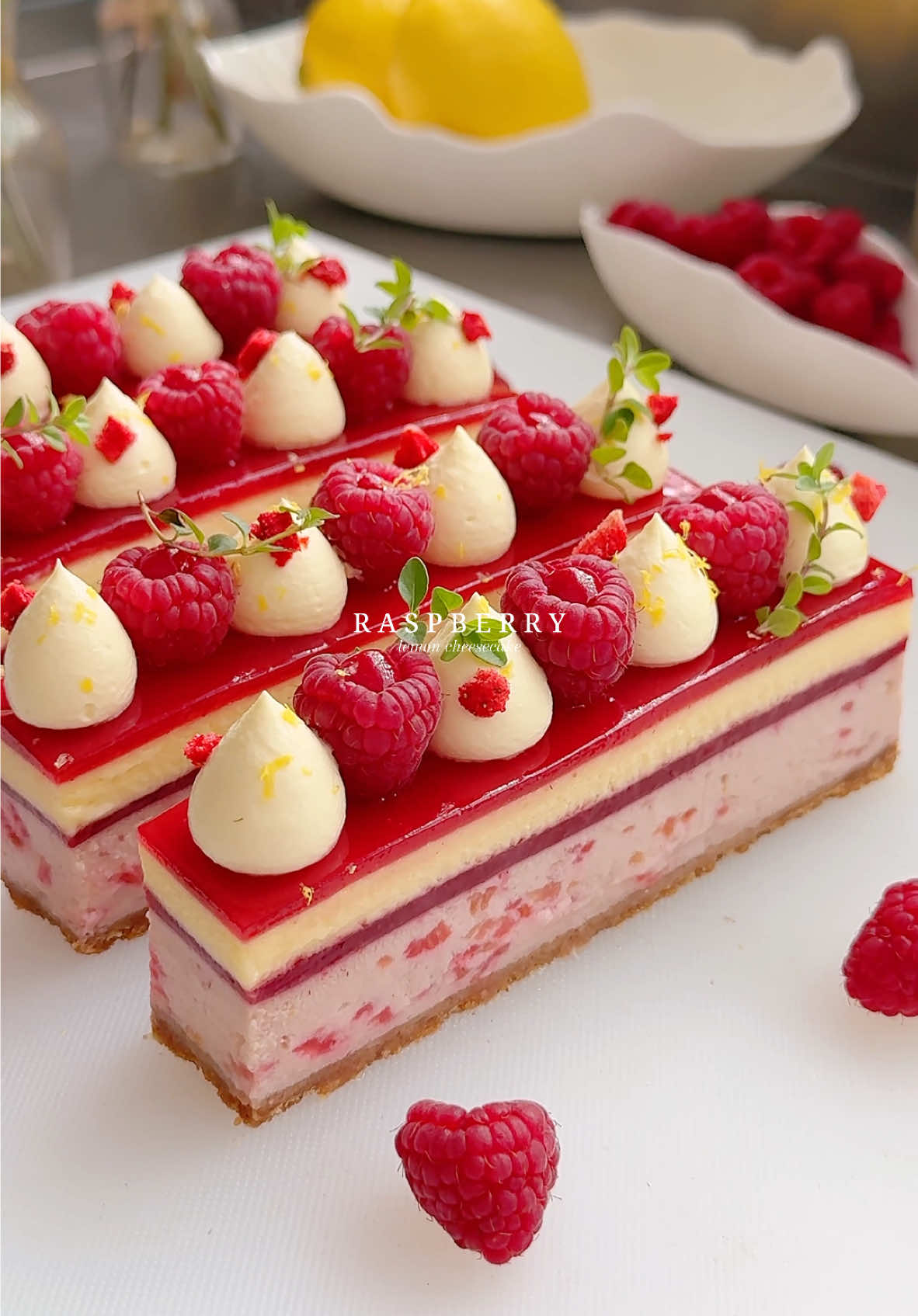 Raspberry lemon cheesecake♥️ Creamy raspberry cheesecake baked over a buttery biscuit crust and topped with raspberry confit, light lemon mousse and raspberry glaze. It’s delightfully refreshing, perfectly sweet-tangy and full of delicious raspberry lemon flavors🍋 Recipe’s available on my Substack (link in my profile).  #raspberry #lemon #cheesecake #ValentinesDay #caketok 