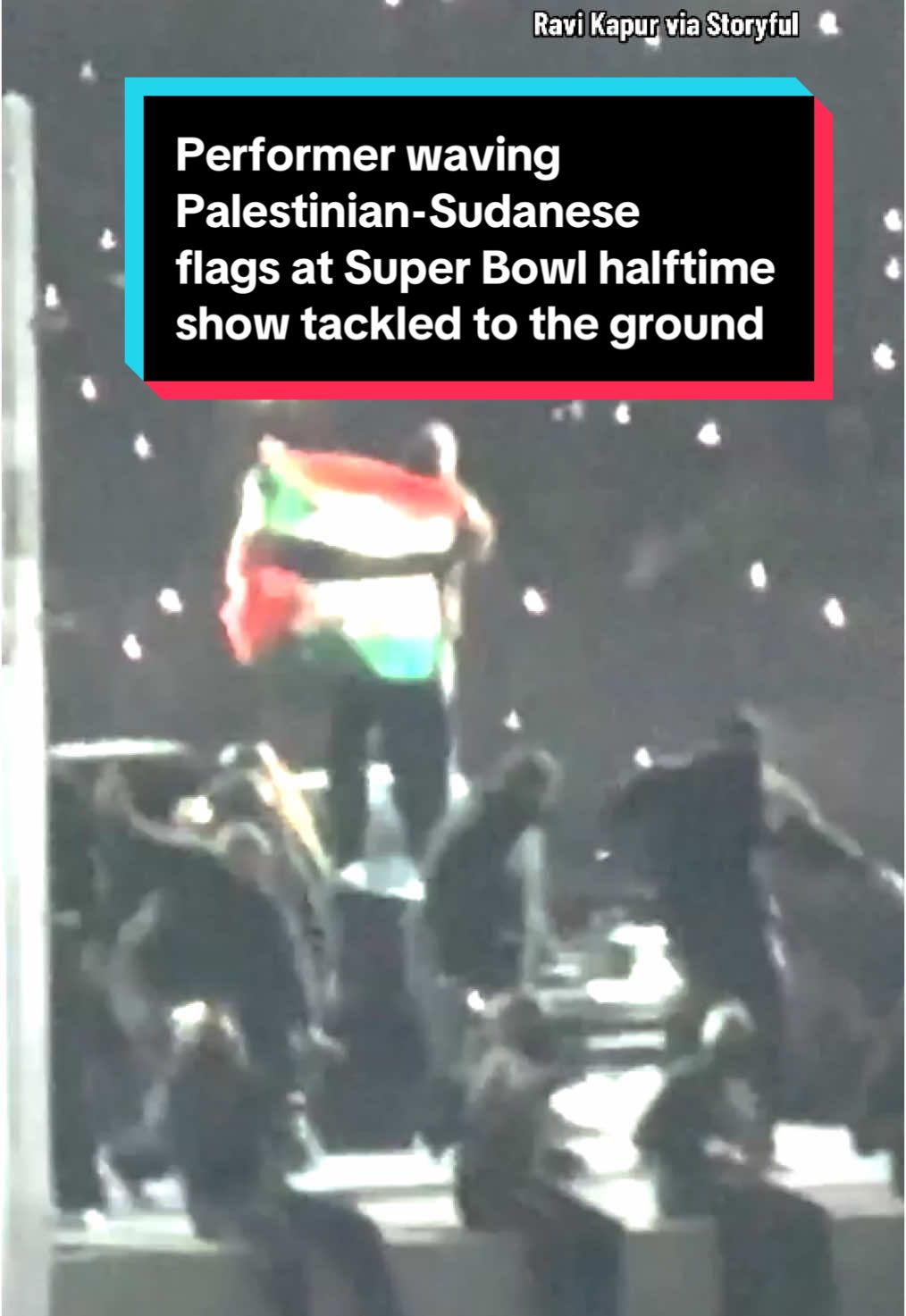 A performer who was part of Kendrick Lamar’s Super Bowl halftime show was tackled to the ground and detained by security toward the end of the performance after waving the Sudanese flag and Palestinian flag together with the words “Sudan” and “Gaza” written on them. Roc Nation, the company behind the show, said the protest was “neither planned nor part of the production and was never in any rehearsal,” and the NFL said the person will be “banned for life from all NFL stadiums and events.” #nfl #SuperBowl #eagles #football #gaza #sudan 