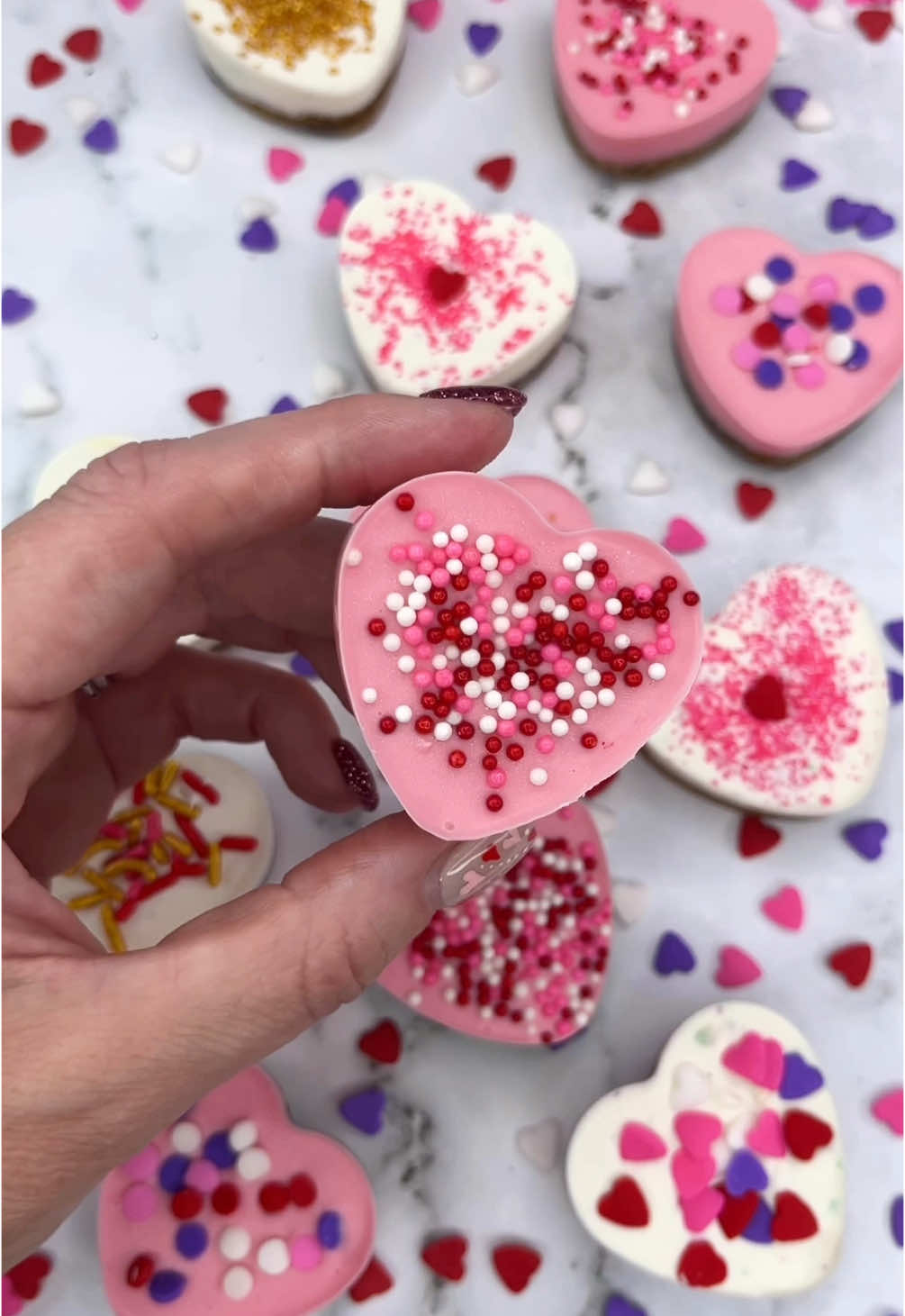 Love bites 💘💗❤️ The perfect treat for #ValentinesDay Super simple and they taste AMAZING 🤩  You can use shop bought cookie dough or make your own 🍪💘 🍪 Add small cookie dough balls into your silicone mold and bake.  🍪 Once cooled top with chocolate melts and sprinkles.. Let them set in the fridge before you pop them out The heart mold, sprinkles and candy melts are from Wilton cakes 💕 xx #valentines #bakinginspo #cakedecorating #EasyRecipes #bitesize #cookies #cakedbyrach 