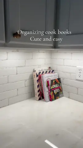 A simple and easy kitchen refresh!! I found the basket at @HomeGoods #kitchenorganization #cookbooks #cookbookorganization #kitchendecor #kitchen #newkitchen #organizedhome #organization 