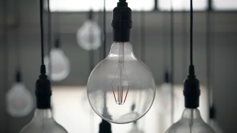The tungsten filament of the electric light bulb lights up and then goes out.#commerciallighting #modernlights #lightdesign #LEDlight