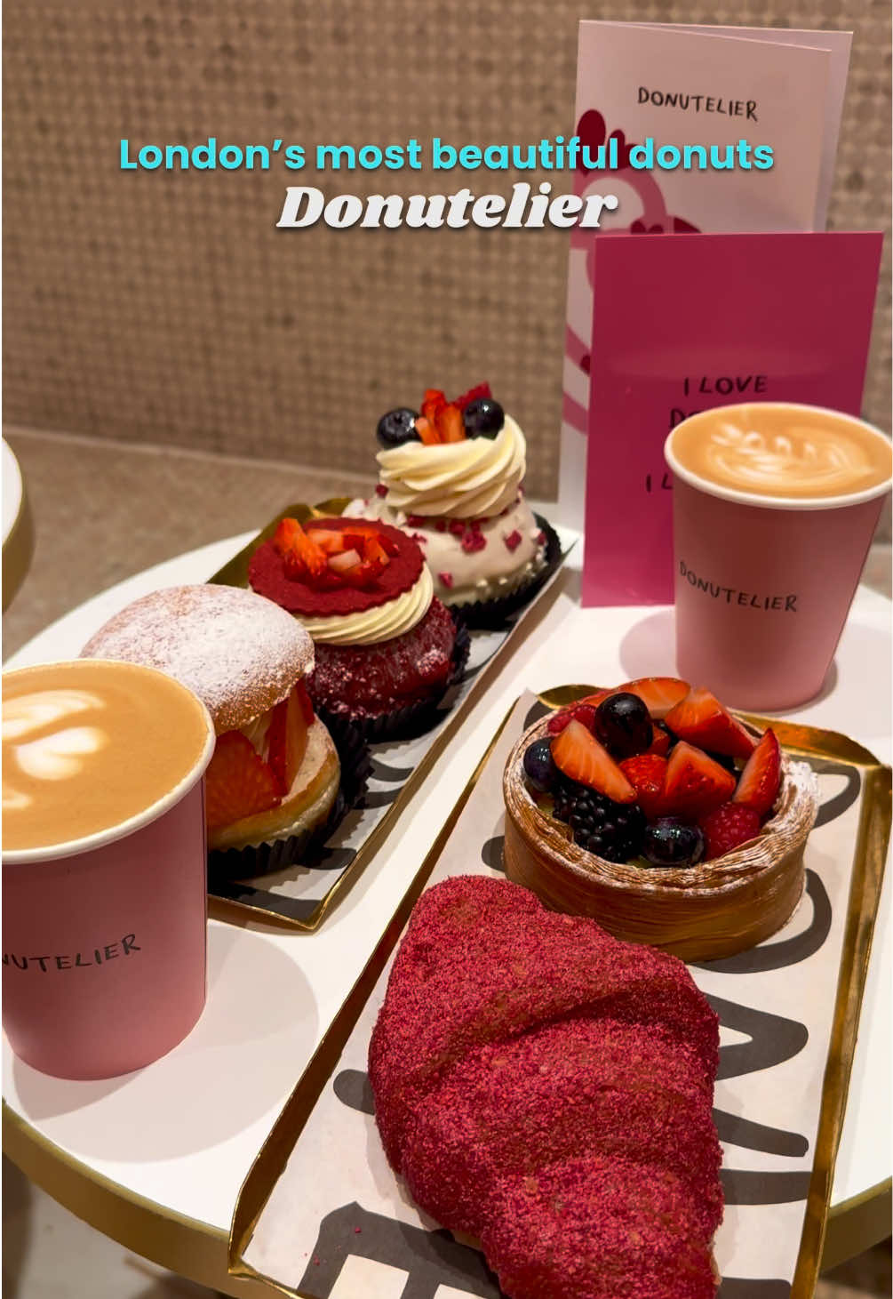 Forget the flowers, this Valentine’s Day we are falling in love with donuts 💕🍩 Dubutelier isn’t just a bakery — it’s where classic donuts meet haute couture craftsmanship. Inspired by the meticulous artistry of the world’s finest fashion ateliers, Dubutelier creates the most luxurious and delectable pastries London has to offer. We indulged in their exquisite limited-edition Valentine’s Day collection (available until February 26th), and trust us — every bite is a love letter to your taste buds 💕   📍48-50, Charing Cross Rd   Here’s what we ate: ✨ Berry Velvet Croissant Buttery, flaky pastry filled with silky crème pâtissière and frutti di bosco, finished with a delicate raspberry sugar crust. ✨ Mixed Berry Danish A Pain Suisse pastry with an almond cream base, velvety vanilla ganache, fresh mixed berries, and a light dusting of sugar. ✨ Strawberry Amour Luscious mascarpone ganache and strawberry jam, topped with almond crumble, Chantilly cream, almond sable, and fresh strawberries. ✨ Berry in Love A dreamy combination of vanilla ganache and frutti di bosco, crispy raspberries, yogurt crisps, Chantilly cream, fresh berries, and an almond sable heart. ✨ Strawberry Cream Croissant A buttery, flaky croissant filled with strawberry jam, Chantilly cream, fresh strawberries, and a sprinkle of sugar. ✨ Raspberry Marzipan Swirl (VE) A vegan delight with raspberry and marzipan filling, fondant icing, raspberry jam, freeze-dried raspberries, and delicate rose flakes. If you’re looking for a sweet way to celebrate love this season, don’t miss out on this unforgettable collection! ❤️   #london #donuts #food #donutelier #sweet #delicious #february @Donutelier 