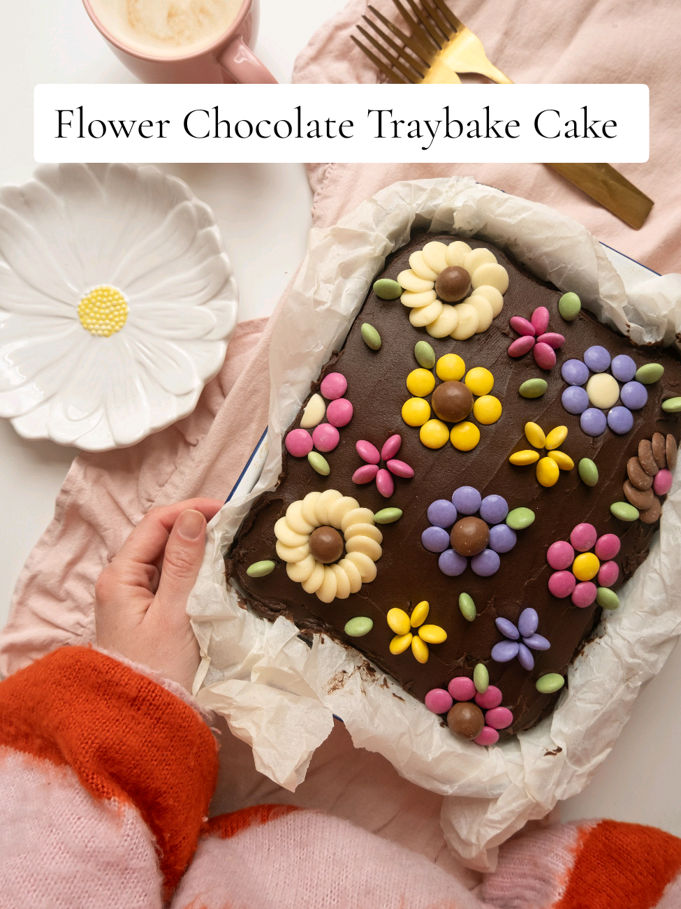 Flower Chocolate Traybake Cake Recipe 🌼 I made a round layer cake with this a few years ago so it's time for a traybake version! Recipe below 👇🏻  50g cocoa powder 6 tbsp boiling water 100g soft butter 275g caster sugar 3 large free-range eggs 125ml milk 175g self-raising flour 1 tsp baking powder Chocolate frosting, maltesers, smarties and chocolate buttons for decorating.  Preheat the oven to 180°c and line a 12x9 rectangular tin.  In a heatproof bowl add the cocoa powder and boiling water and make a paste.  In a bowl of a stand mixer (or using an electric whisk) beat together the butter and cocoa mix until smooth. Add in all the remaining ingredients and whisk together.  Pour into the tin and bake for 30-35 minutes. Leave to cool in the tin completely.  Once cool spread over chocolate frosting and arrange the sweets to make flowers. Cut into slices before serving.  #cakedecorating #chocolatecake #bakingrecipe #bakingaesthetic 