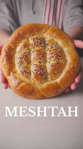Ramadan’s Bread |  مشطاح رمضان 🍞 a soft and fluffy bread perfect for suhoor Ingredients | المكونات: #مشطاح  #Ramadan_preps #toomacooks #tiktokcookbook   3 ½ cups Extra flour | ٣ ونصف كوب طحين اكسترا 1 ½ cups warm milk | كوب ونصف حليب دافئ ½ cup oil | نصف كوب زيت 1 tbsp yeast | ملعقة كبيرة خميرة 1 tbsp sugar | ملعقة كبيرة سكر Pinch of salt | رشة ملح Instructions | الطريقة: Mix all the ingredients and knead until a smooth dough forms. اخلطي جميع المكونات واعجني حتى تحصلي على عجينة ناعمة. Cover and let it proof for 1 hour. غطي العجينة واتركيها لتختمر لمدة ساعة. Shape the dough as desired and let it rest for 10 minutes. شكّلي العجينة واتركيها ترتاح لمدة ١٠ دقائق. Brush with egg wash (egg yolk + milk) and sprinkle sesame seeds. ادهني الوجه بخليط صفار البيض مع الحليب ورشي السمسم. Bake at 180°C (350°F) for 15-20 minutes or until golden brown. اخبزيها في فرن محمى مسبقًا على ١٨٠ درجة مئوية لمدة ١٥-٢٠ دقيقة أو حتى يصبح لونها ذهبيًا.