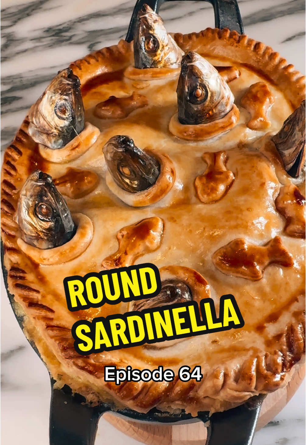 COOKING EVERY FISH IN THE WORLD 🐟 🌍  Episode 64 - Round Sardinella • BIN: Sardinella aurata FR: Allache GER: Sardinelle ESP: Alacha / lacha IT: Alaccia / laccia SRB-CRO: Srdela golema / velika •  A great British culinary classic: Stargazy / Stargazey Pie! This dish originates from Cornwall, so it is only fitting to have this recipe inspired by one of the greatest chefs at one of most revered seafood restaurants in the UK - chef Rick Stein @Rick Stein Recipe of Restaurant Rick Stein 🫡 This is quick and easy comfort food at its best (and very affordable!) Fresh catch of the day from Fin & Bone in London Fulham  • Ingredients (serves 2): 30g butter 30g flour 1 chopped onion 1 chopped leek 3 rashes of chopped streaky bacon 50ml white wine 250ml fish stock 300ml double cream Pinch of saffron or turmeric Chopped parsley Splash of lemon juice 3-4 quail eggs  250g shortcrust pastry (2 sheets) Egg wash  • Recipe: 1. Prep, or fillet, the fish as shown in this reel. 2. Fish pie mix: Sweat down the onion, bacon and leeks in the butter. Add the flour, deglaze with the wine and add the fish stock. Cook for 10 minutes, then add the saffron or turmeric and pour in the cream. Cook until the sauce thickens. Finish with parsley, lemon juice and seasoning and set aside to cool down. 3. Line a pie dish with the pastry and pour in the fish pie sauce. Arrange the eggs and the sardines on top. Cut out small holes in the second pastry sheet matching the position of the fish heads and cover the pie, whilst making sure that the fish heads pop through the holes. Decorate with cut out pastry forms and brush with egg wash. Bake at 180C for 45-55 minutes. Enjoy!