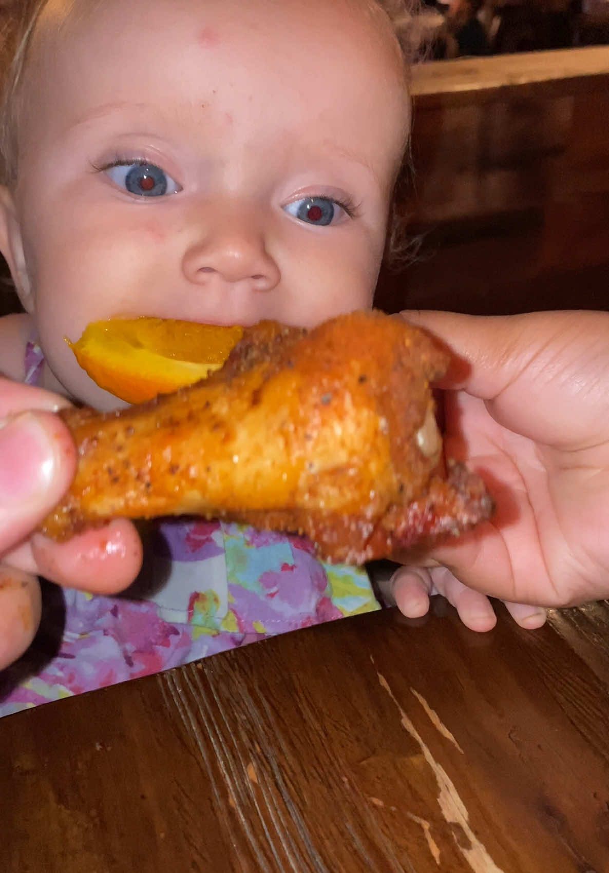 Rhea tries a chicken leg but it’s really an orange 🍊 