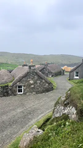 The Gearrannan and Arnol Blackhouse Villages. For centuries, Highlanders and their livestock lived in these one-room abodes. The houses, which featured packed earth floors, drystone walls, and thatched roofs, offered refuge from the wild North Atlantic weather. A peat fire in the central hearth kept the space warm, and a divider separated the human inhabitants from their farm animals. Sharing with animals made the house warmer and meant fewer buildings were needed. The blackhouse has a central door and inside is an aig an teine (‘living room’) and a bathaich (‘cattle byre’), with a parallel sabhal (‘barn’). The Arnol blackhouse is a unique relic. Once the home of a Hebridean crofting family and their animals, the thatched house is preserved almost as the family left it when they moved out in 1965. The blackhouse was built between 1852 and 1895. It may look primitive, but this kind of dwelling was well suited to the harsh climate and the residents’ scarce resources. Close by to the Arnol Blackhouse is the Gearrannan Blackhouse Village. Between 1945 and 1965, other crofts and blackhouses on the Isle of Lewis received running water and electricity. People lived in these houses until the 1970s, when the village’s remaining elderly residents moved into more modern homes. It seemed as though the village would then be lost to time, destined to crumble and decay until it was no more than a ruin. However, in 1989, Urras nan Gearrannan, the local trust, stepped in to restore and preserve these historic buildings. Today, the renovated blackhouses are available as holiday accommodation. Each building is named after the family that once lived there, and parts of the village serve as a museum that honours this bygone way of island life. #Scotland #explore #beautiful #history #beautifuldestinations #visitscotland #outerhebrides #lotr #hobbit #earthfocus #fy #scottish #hidden #peace #lordoftherings #inspiration 