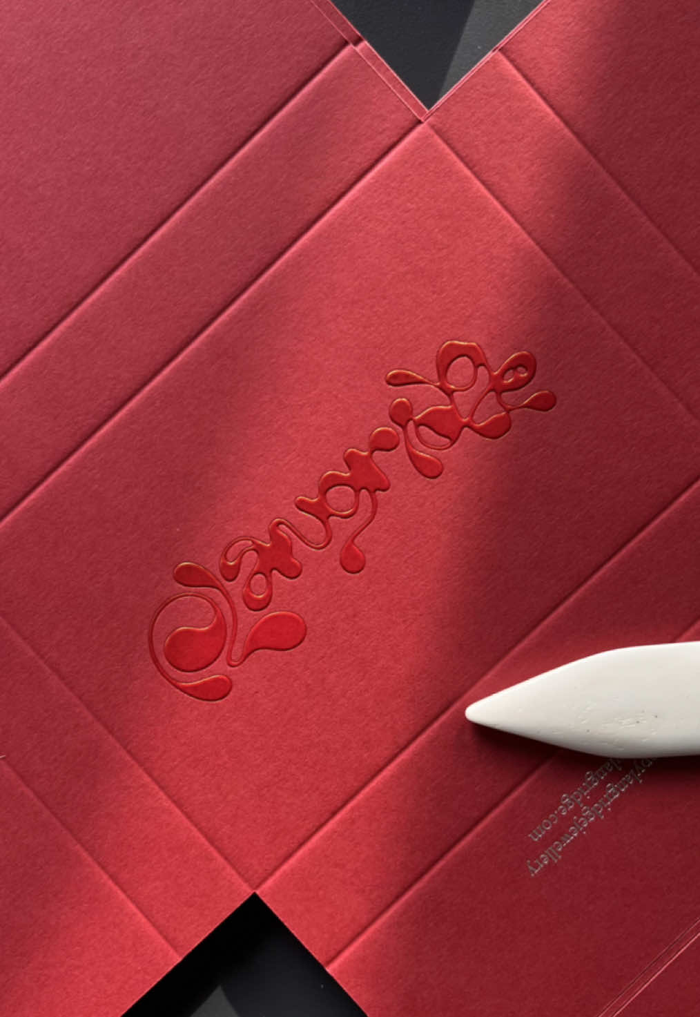 Making up a new colourway of @poppy the jeweller jewellery packaging. Printed with silver foil blocked details and red pigment foil emboss on the front. Design and branding by @artbyfreddiexx  Paper: Colorplan Scarlet from @GF Smith  Finish: Red foil emboss / silver foil blocking 
