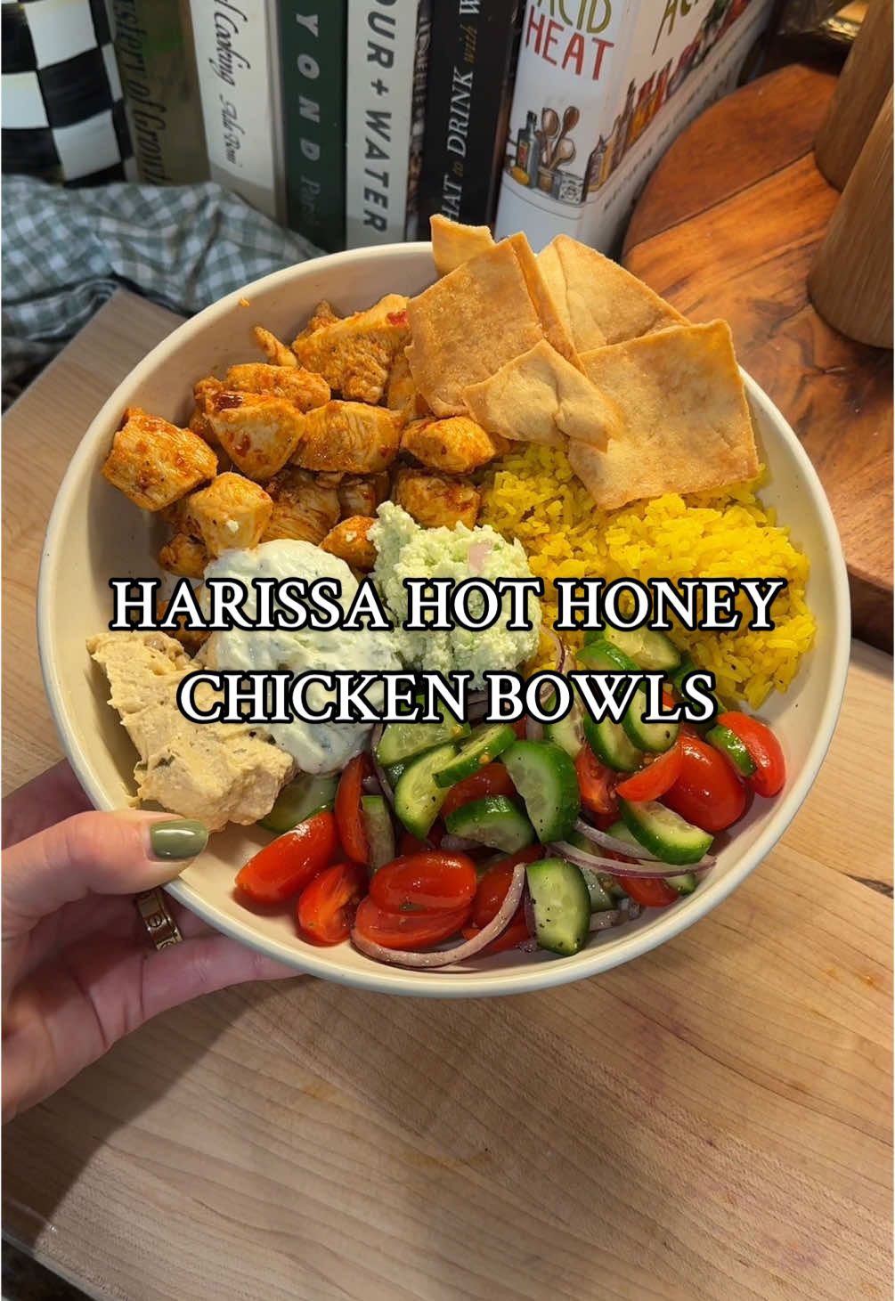 Harissa hot honey chicken bowls make for great meal prep! For the bowl: Harissa hot honey chicken Turmeric rice Greek salad Hummus Feta mixture Tzatziki  Pita chips  Chicken Ingredients:  4 chicken breasts, cubed 3 tbsp harissa paste  3 tbsp hot honey 3 tbsp avocado oil Additional avocado oil for cooking  Juice of 1/2 lemon  1 tsp salt ½ tsp pepper 1 tsp garlic powder 1 tsp onion powder 6 cloves garlic, minced  ½ shallot, diced  1 tsp grated ginger Chicken Method: Start by cubing your chicken breast and placing in a large bowl. In a separate bowl, add all ingredients except chicken and mix well to combine. Pour ¾ of the marinade mixture over the chicken and mix so chicken is coated.  Heat large pan over medium high heat. Add a little bit of avocado oil to coat pan before adding chicken. Try not to crowd the pan, you may need to do two batches. Let cook for about 3 minutes without disturbing before flipping and cooking another 2-3 minutes, or until they are just about cooked through. Add remaining ¼ of your marinade, stir, and let cook for another minute or so to get nice and hot.  Rice:  1.5 cups jasmine rice ½ shallot, diced  4 cloves garlic, minced  2 tbsp butter  2 tsp turmeric 1 tsp salt ½ tsp pepper  1.5 cups broth of choice  Rice Method:  I use a rice cooker. After rinsing my rice, I add all ingredients to the rice cooker and cook on quick rice mode.  Feta mixture: 1 block feta 1 jalapeno  1 juice of 1 lemon 4 cloves garlic ½ shallot Drizzle of olive oil  Salt and pepper, to taste  Feta Method:  Add all ingredients to a food processor and mix until desired consistency.  #dinner #Recipe #cooking #EasyRecipe ##DinnerIdeas #dinnerrecipe #dinnerinspo #chickenbowl 