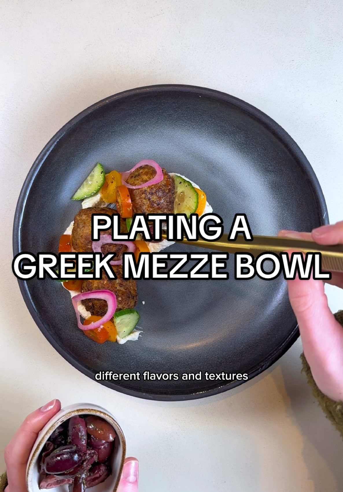Plating a Greek mezze bowl! In plating, asymmetry and odd numbers plus negative space will usually result in something really visually pleasing 👩🏼‍🍳🥰 #plating #asmr #asmrfood #foodstyling #platingideas #greekfood 