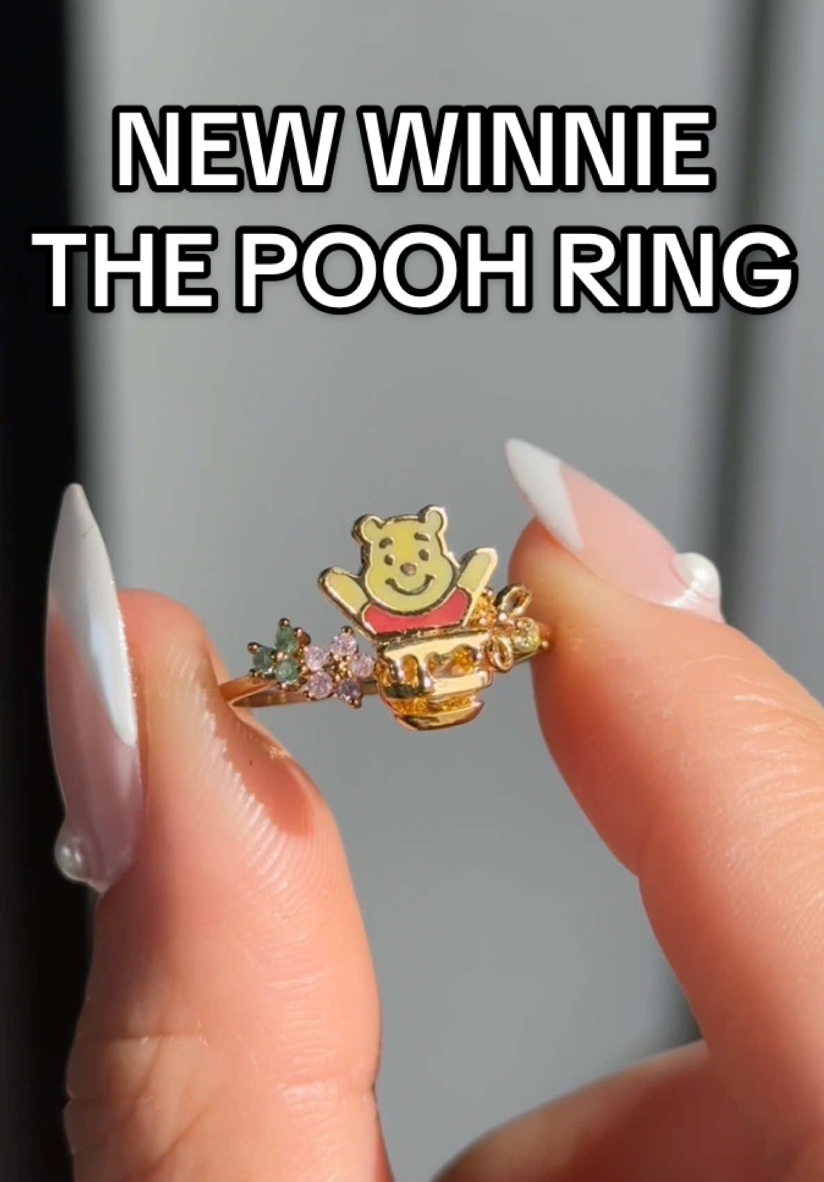 The cutest accessory in the Hundred Acre Wood🥹 Our Disney Silly Old Bear Ring features an adorable Pooh and his hunny pot, a buzzing hunny bee, and shimmering florals 🍯🌸✨ Shop this NEW ring and our ENTIRE Winnie the Pooh Collection on our site 💛  #disney #disneystyle #winniethepooh #disneyjewelry #disneyaccessories 