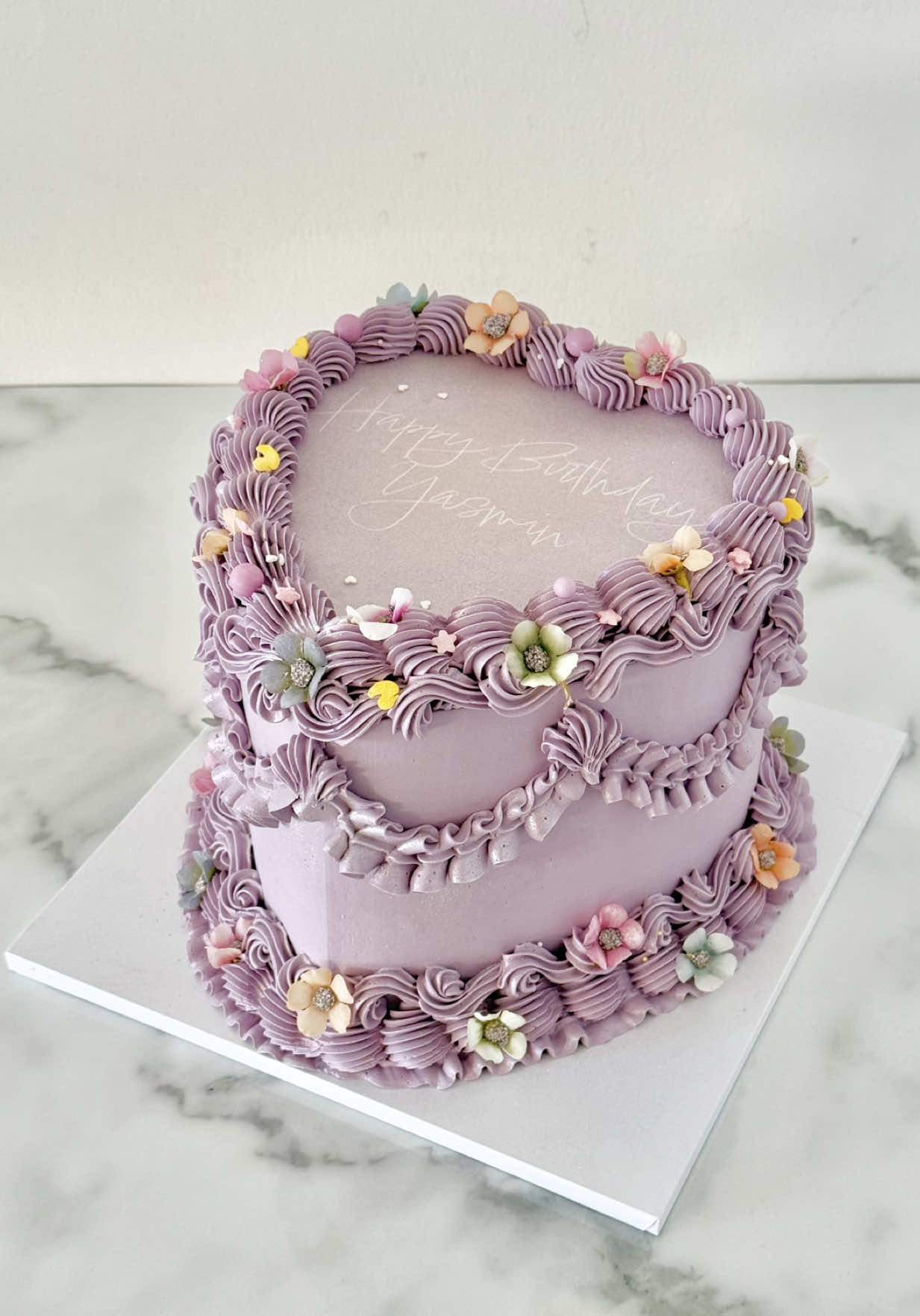 Tangled-themed heart cake with a burn away layer to reveal the iconic sun symbol 🌞  #vintageheartcake #burnawaycake #caketutorial #caketutorials #vintagecaketutorial #repunzlecake #tangledcake #tangledrapunzel 