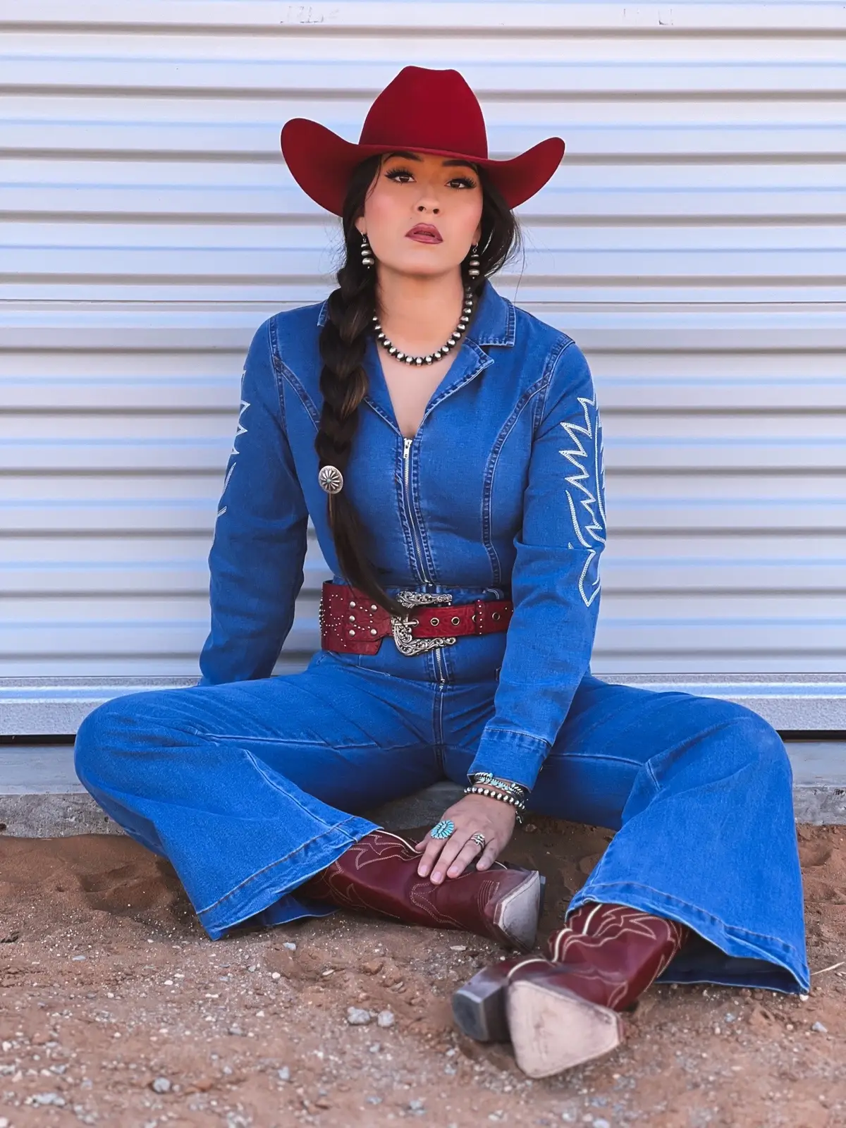 When denim and red collide together 😮‍💨👌🏻🍒 @Lucky & Blessed  Hat: @pro.hats MICHELLEDPH Necklace: @nizhonitradersllc MICHELLE15 Jumpsuit & Belt: @luckyandblessed_official  Rings: (square) @lovestruck.turquoise (cluster) @alyssa.jewelry.creations MICHELLE10 (cluster2) @turquoise.texas  Boots: @idyllwind  Hair tie: @horseshoejco  #westernfashion #western #westernstyle #vaquerastyle #modavaquera #luckyandblessed