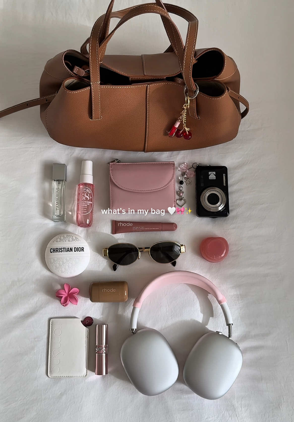 what’s in my bag ✨🤍👜 #whatsinmybag #aesthetic #aestheticvideos #pinterestaesthetic #pinterestgirl #girlygirl #fyp #pourtoi @Sol de Janeiro @Kodak Europe @Diorbeauty @rhode skin @fwee @YSL Beauty 