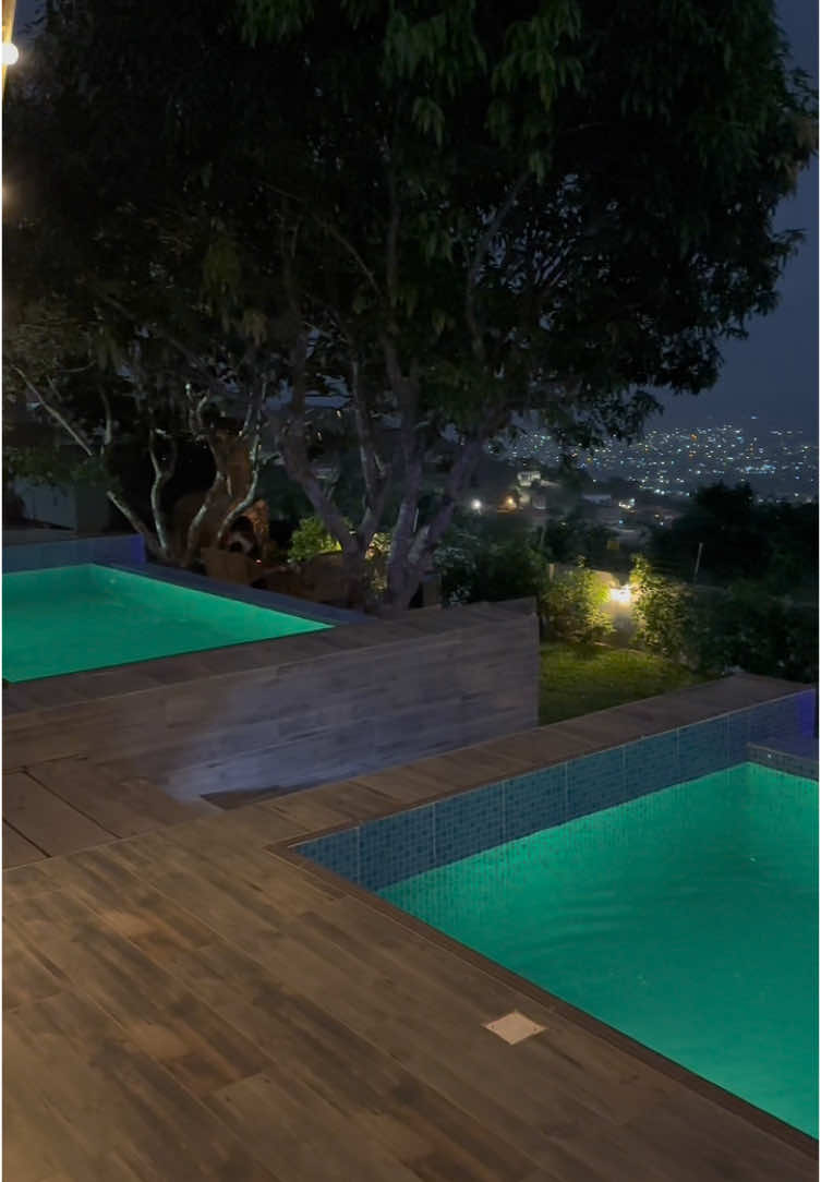 View from the private infinity pool at night 😍 Complimentary Activities include  •Swimming •Couples card game •Gazing at Accra city light from the mountain top •Jenga(wood stacking game) •Scrable •Chess •Monopoly  •Ludo •Oware •Draught •Ring toss game •Playing card and Uno •Butterfly watching •Hiking •Cycling  Tour guide available on standby if necessary   Contact Host for your reservation #fyp #accra #accraghana #233 #accraghana🇬🇭 #accratiktokers #independenceday #accraghana🇬🇭 #accratiktokers #theframecabin #fyp #explore #ghana #aburi 