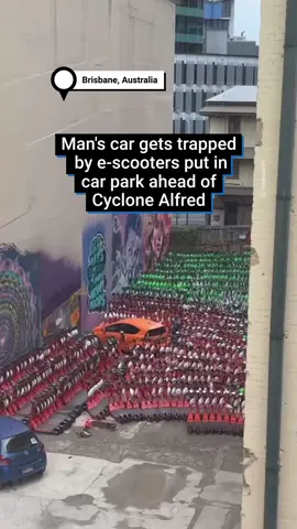Ahead of the cyclone, e-scooters in Brisbane were relocated to an empty lot in Spring Hill but a car had already been parked there for two days before Lime and Neuron moved their e-scooters to the site, according to the person who filmed the video.  As a result, the car's owner had to painstakingly move the e-scooters one by one to free their car. 😅 #scooter #cyclone #escooter #brisbane #australia #news 