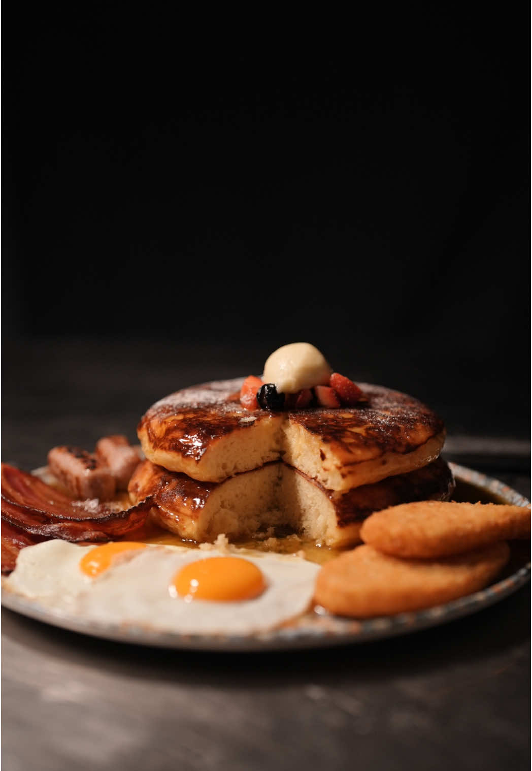 Ready for your big breakfast? #pancakes #honeybutter  A stack of extra fluffy buttermilk pancakes, soaked in warm maple butter syrup, layered with berry compote, finished with a smooth honey butter quenelle. On the side—free range eggs, sunny and golden. crispy hash browns. streaky bacon, sizzling and rich. every bite, the perfect balance of sweet and savory. made effortlessly with crumble cookware—beautiful, nonstick, and built for the way you cook. Subscribe to see the full recipe  #cooking #breakfast #pancakestack