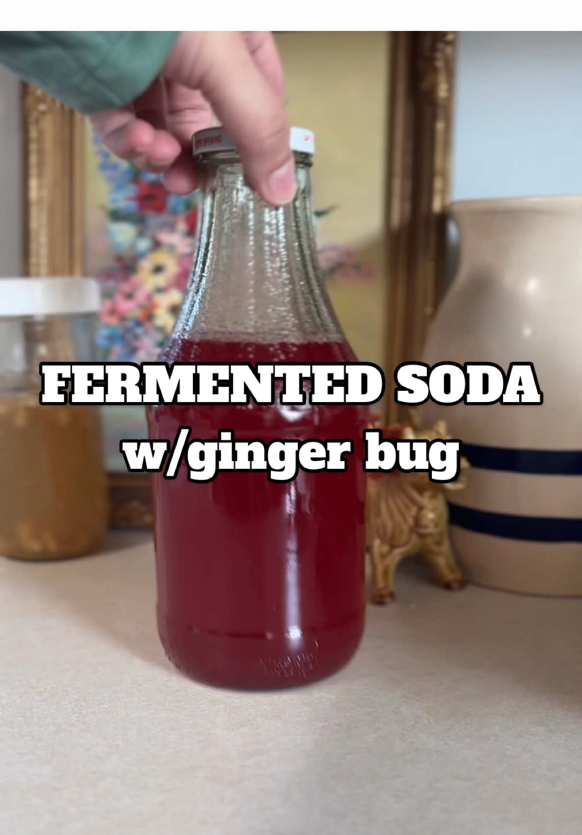 Making a soda at home is way easier than you think. Obviously it won’t taste like a Dr. Pepper but it’s super beneficial and tasty! 😋  How to make: GINGER BUG: Day 1: mix 2 cups of water (filtered/distilled), 2 tbsp chopped organic ginger (with peel), and 2 tbsp sugar in a clean container. Place lid on loosely and place it on your kitchen counter.  Day 2-6: feed your bug daily with 1 tbsp ginger and 1 tbsp sugar. Mix throughly. The temp of your kitchen will affect the speed at which your ginger bug ferments. You'll know it's ready when it's frothy on top and produces bubbles.  To make the SODA: Use a clean sterilized bottle/jar. Add in 2 cups of juice of your choice (make sure it has some type of sugar). Next, strain your ginger bug with a fine mesh colander and add in 1 cup. Let sit at room temp for 2-3 days, then refrigerate before serving. If a bubbly ring is forming at the top of your liquid, you know it's working. To keep you ginger bug going: When you use it too it off with water and feed it with 1 tbsp of ginger and sugar. Store your bug in the fridge and feed once a week, or keep it at room temperature and feed daily. #gingerbug #homemadesoda #homemade #madefromscratch #soda #sodapop #probiotics #fermented #fermentation #LearnOnTikTok #homesteading 