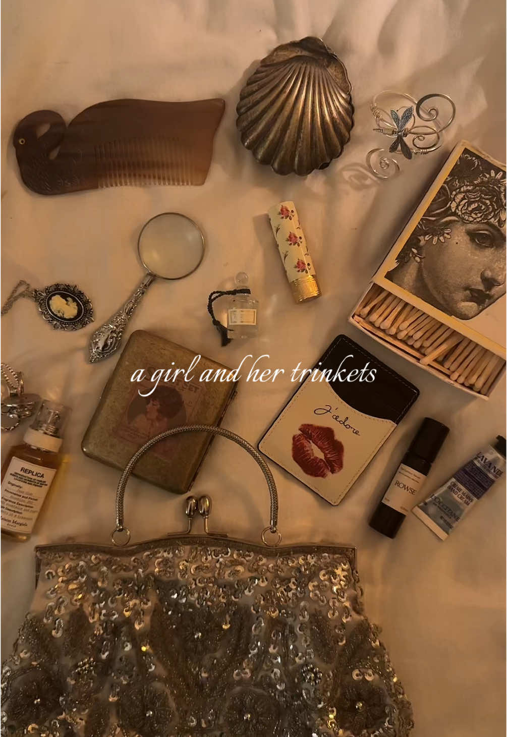 the desire to gather  #fyp #trinkets #antiquetrinkets #antique #whatsinmybag #chic #sade #dukeandexter #women #girls #justagirl #foryou #lipstick #maisonmargielafragrances #silver 