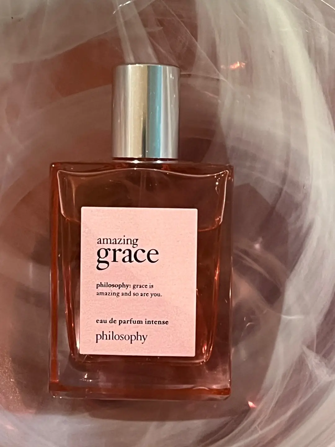 #philosophy amazing grace eau de parfum intense. This is a fruity-floral fragrance for women. New scent, it was launched in 2022.  The notes are beautiful: raspberry and wild strawberry, the middle note is rose and the base is musk. Fruity, sweet, rose, musky and powdery accords. The longevity is one of the greatest within philosophy fragrances, and the sillage is moderate. With the first spritz I smelled the raspberry and a hint of strawberry. After a few hours, it’s not the total dry down yet, it switches into a floral blend. Lately I’ve been more into the rose scents, and my recent purchases were kinda that way. When I was younger, I couldn’t stand the rose fragrances. To me, those were the grandma scents and much later I found one perfume from a luxury brand, which changed my whole vision. I started to see the pink in the scent, started to smell the dew on the rose hip. Then all that went away, again and I was interested in vanilla, musk..Not realizing that everything is unabiding but somehow I was always drawn back to the roses. I think there is no fragrance brand out there which doesn’t have at least one rose based fragrance. The brand is famous for using roses almost with everything. A bath salt, body scrub, shampoo and other products have a light rose scent. This perfume is different from the other graces, because it is the intense version of. It’s rare when a perfume stays on my skin for hours but this one does! Even the dry down is not that typical skin scent, it’s powdery a bit soapy and sweet. It doesn’t scream OMG! or Yes, this is it! , but it’s comforting, sexy and romantic.  Yes, there are better rose perfumes out on the market. But the price tag on this one is affordable and not too crazy. Who didn’t try it yet, give it a chance. See for yourself is it worth? Maybe on someone else will the berries take over and not the rose. That’s one of the many reasons I love perfumes: it will become a part of myself, a piece of me will give the scent that what will make it different from the others. Because it has my skin chemistry and the notes blending together will give a unique scent and that’s completely mine! My link to get a discount: https://community.philosophy.com/s/marijanah #philosophy #philosophycreators #selfcareroutine   @philosophy 