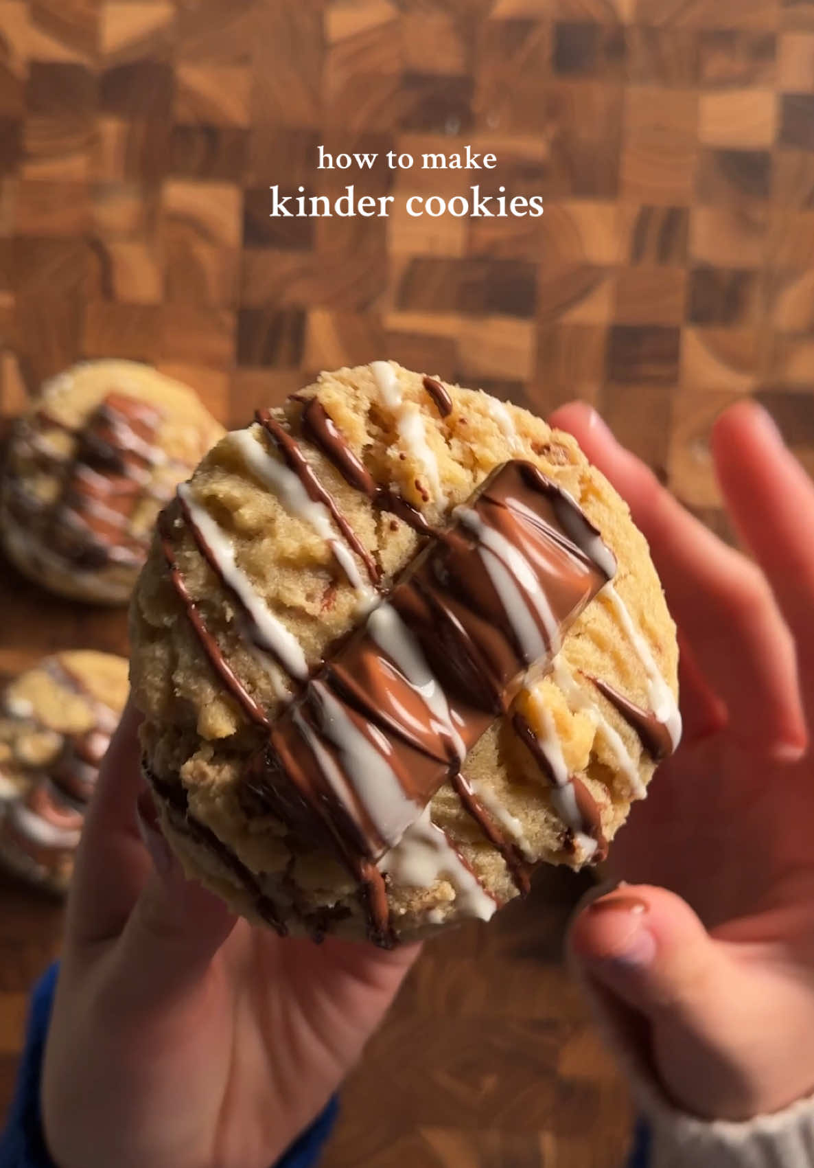 Kinder Cookies 1 1/2 cups (190g) flour 1/2 tsp (2g) baking powder 1/2 tsp (2g) baking soda 1/2 tsp (3g) salt 1/2 cup (113g) melted butter 1/2 cup (100g) brown sugar 1/4 cup (50g) white sugar 1 egg + 1 yolk 1 tsp (4g) vanilla ~1 cup chopped kinder [makes 8-10 cookies] melt butter and mix in the sugars well. add in eggs and vanilla. in another bowl, whisk together the baking powder, baking soda, and salt. add the dry into the wet and mix gently. then add in the chopped kinder chocolate pieces. scoop dough and press a kinder piece inside the middle (i used about a 3tbsp scoop). place on baking sheet and rest for at least an hour in the fridge, it just helps with flavor and texture. bake at 350 for 12-14 min! Optional: top with kinder pieces and melt chocolate to drizzle over cookies! #kinderchocolate #kinder #cookies #baketok #Recipe 