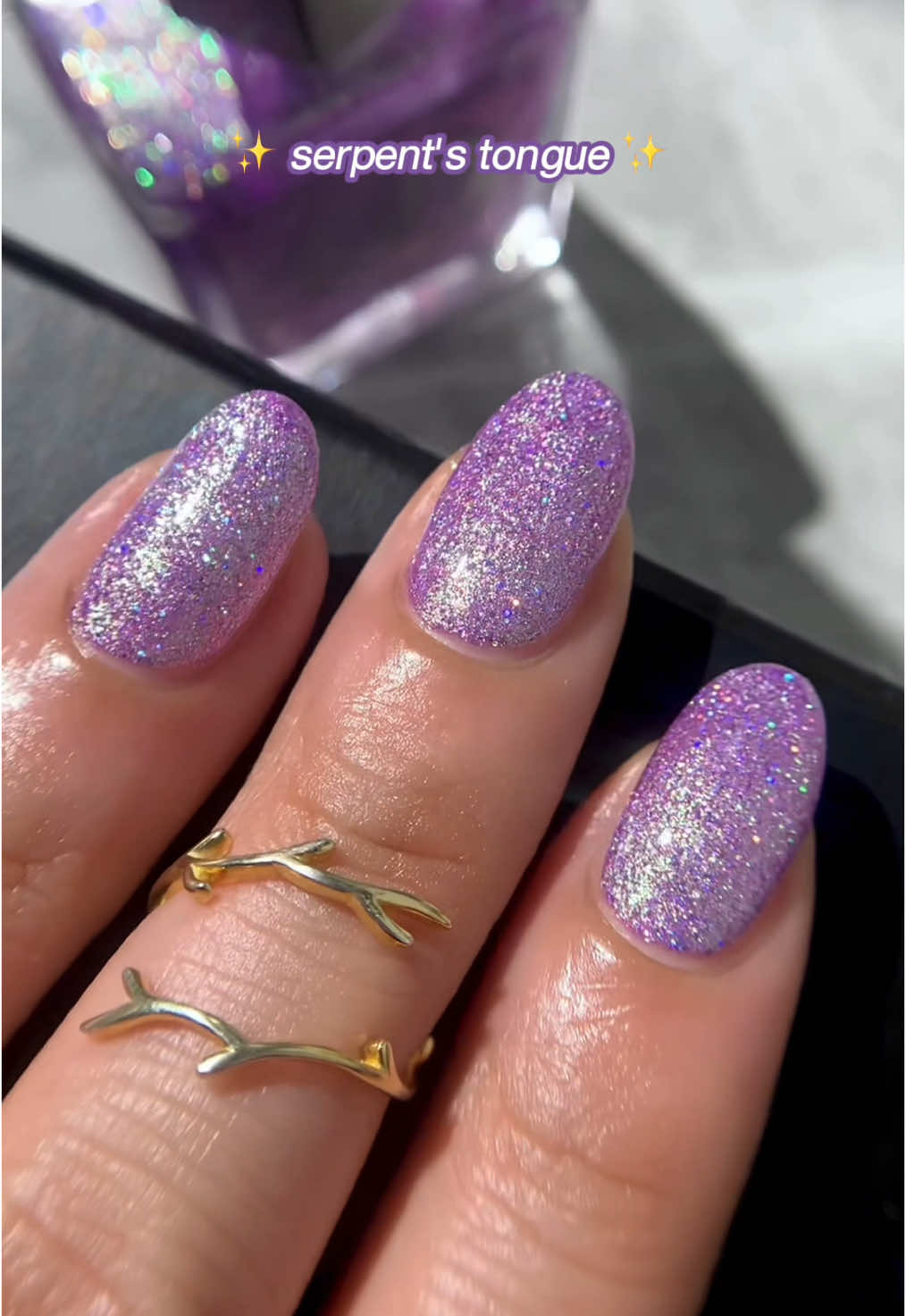 🐍 serpent's tongue 🐍 is a duochrome lacquer w holo glitter that shifts between shades of purple and green ✧ #mooncat #nails #nailinspo #nailideas #springnails #purplenails 