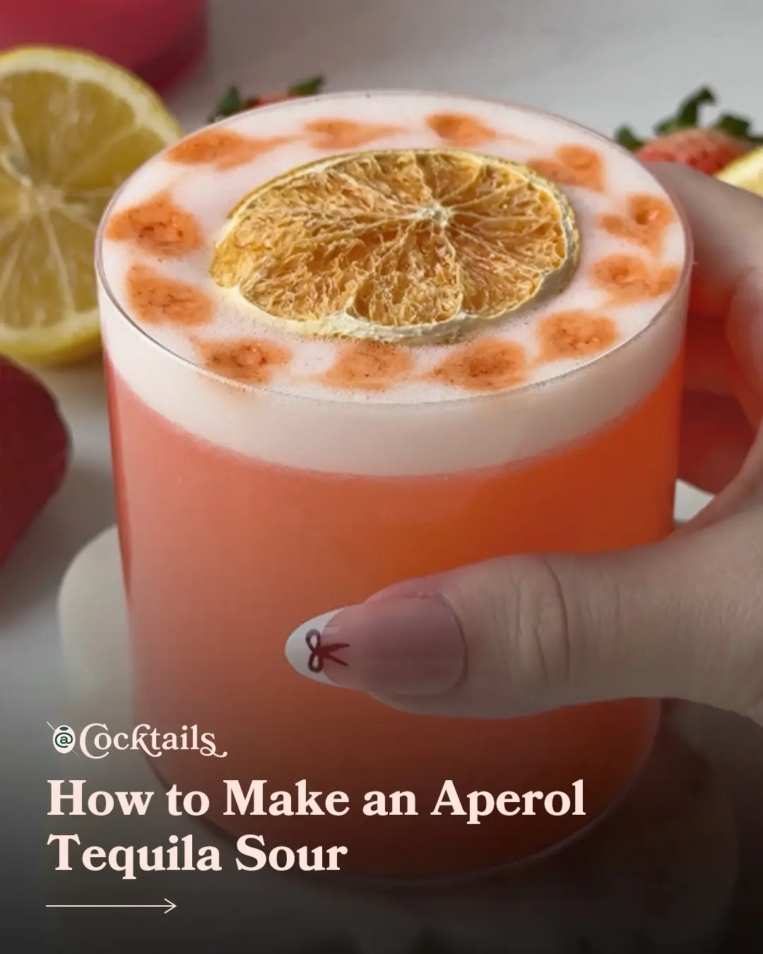 Aperol fans, you need to try this Aperol Tequila Sour. 🍊 Recipe by: @Natalie Migliarini  * 1.5 oz. tequila * 1/2 oz. Aperol * 1/2 oz. strawberry syrup * 3/4 oz. lemon juice * 1 egg white * Angostura bitters & dried lemon #cocktails #aperoltequilasour #aperol #tequilasour #tequila