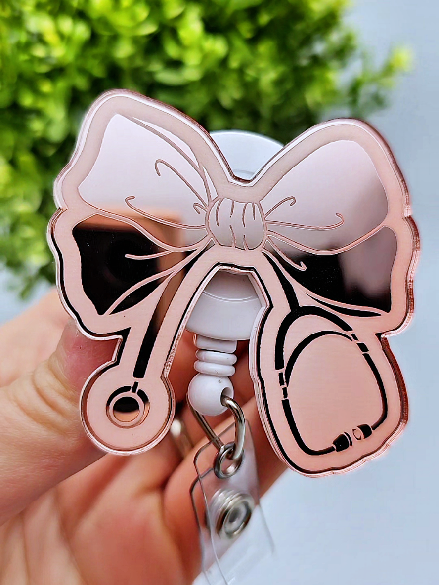 If this isn't the most perfect badge reel for a nurse, I don't know what is 😂💖 Also, do we need this in gold mirror as well?! #nursesoftiktok #nursetok #ernurse #icunurse #nurselife #medsurg #cna #lpnstudent #nursingstudent #healthcareworker 