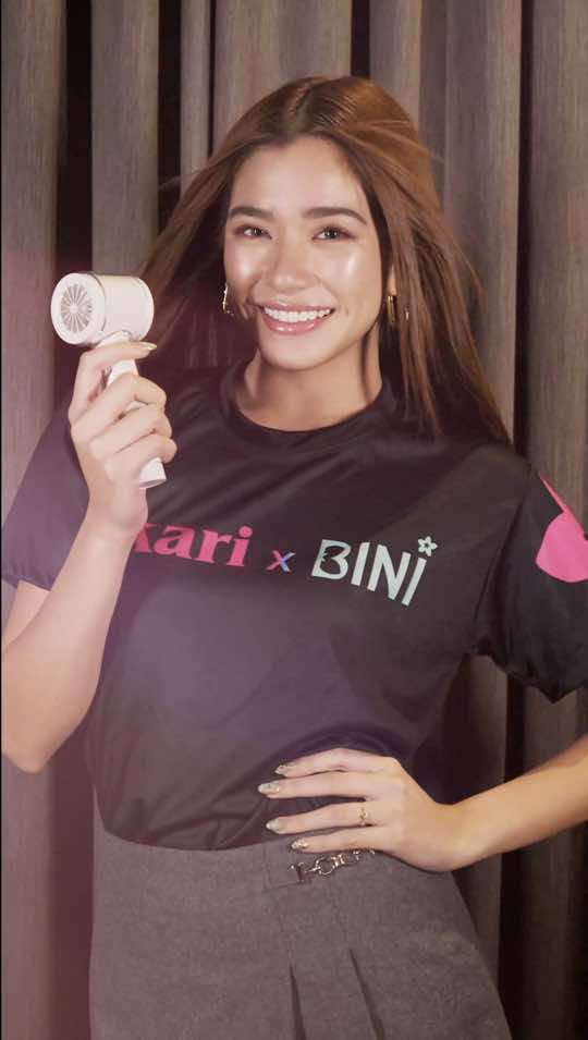 BINI Aiah is here to serve freshness all day, everyday! 💖 Stay cool anytime and anywhere like BINI with your very own #AKARIxBINI #1BloomingFans ! 🌬🌸 🛒 Be twinning with our BINI girls and grab your very own #1BloomingFans at www.akari.store or at the WORLDBEX today until Sunday! #BINI #Blooms 