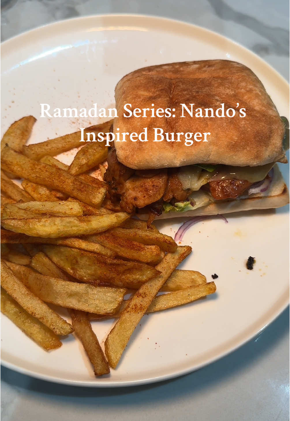 Ramadan series: Nando’s Inspired chicken burgers For the chicken burgers:  1 kilo chicken thigh ( full pieces) - fat cut off  Marinade:  All purpose seasoning - 2tsp  Parsley - 1tsp  Chilli powder - 1/4 tsp  Smoked paprika - 1tsp  Peri peri seasoning - 2tsp  Salt - 1/4tsp  Nando’s medium sauce - 1-2 tbsp  Leave to set (the longer the better) Fry in pan for up to 30-35mins on low heat.  The bigger the thigh piece the longer it will take.  Turn in intervals  Assemble burger  Add cheese  Sauce - mayo/Perinase  Lettuce and Red onion  I made 6 burgers  Enjoy with homemade fries.  #foodfyp #chickenburger #foryoutiktok #fyp #ramadanideas #ramadanrecipes #iftarmeals #iftarideas #nandosburger #nandos #nandossauce #periperichicken #periburger #foodfyp #ramadantok #foodfypシ #foryo #foodfyp #xyzabc #burger #chips #fyppp 