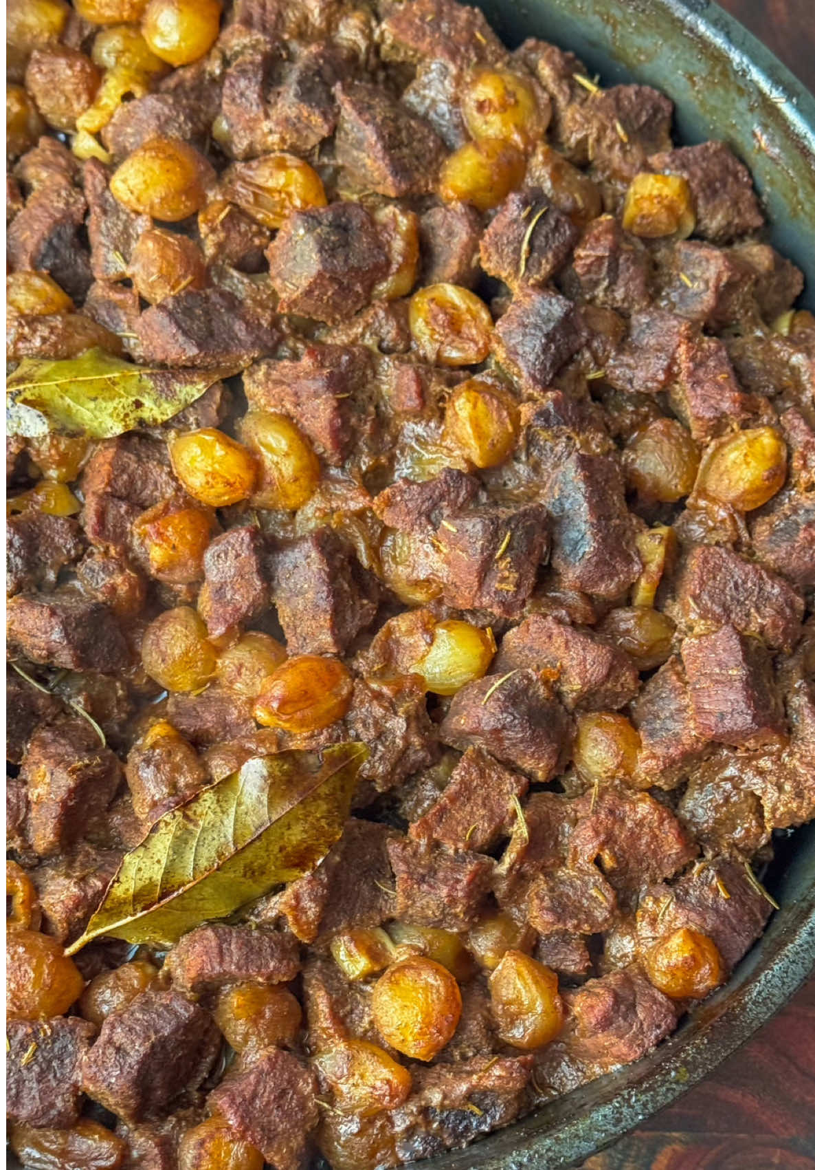 Ramadan Day 17 ✨🌙Tender Juicy Beef and Pearl Onion Stew  Tender Juicy Beef and Pearl Onion stew, perfect for cozy evenings. The best part is, All the ingredients come together in one bowl! You simply mix everything up, making it super easy to prepare. The flavors blend beautifully, creating a comforting dish that warms the heart. Once everything is mixed, you just pop it in the oven and let it bake until tender, The aroma fills your kitchen. You can serve it alongside some bread or fluffy white rice to soak up all the delicious juices.  —Ingredients— 4 pounds either beef round roast, chuck roast or boneless lamb cut into small pieces 3 tablespoons olive oil  3 tablespoons Pomegranate molasses  3 tablespoons Balsamic vinegar  2 tablespoons tomato paste  1 tablespoon Salt  1 tablespoon Paprika  1 tablespoon Garlic powder  1 tablespoon Onion powder  1 teaspoon Black Pepper  1 teaspoon 7 spice (seven spice) 1 teaspoon Cumin  1 teaspoon rosemary 2 cups chicken or beef stock Juice of 1 lemon  6 cloves garlic sliced  2 12oz bags frozen pearl onions  2 tablespoons butter sliced thin  2 bay leaves  1. Preheat oven to 350° F. Cut the beef into small pieces.  2. In a large bowl combine olive oil, pomegranate molasses, balsamic vinegar, tomato paste and all the seasonings, along with the lemon juice and chicken stock (you can also use broth).  3. Give it a good mix, then add in the beef, garlic and pearl onions. Toss really well, transfer to a baking dish. Add the sliced butter and bay leaves on top. 4. Wet a piece of parchment paper and squeeze out the excess water. Unfold and cover the dish along with 2 pieces of foil, cover tightly so no steam escapes during baking.  5. Bake for 3 hours or until beef is tender. Serve with bread or rice and enjoy!  #ramadanday17 #tender #juicy #beef #stew #yummy #EasyRecipe #DinnerIdeas #yum #✨ #🌙 #Foodie #tasty 