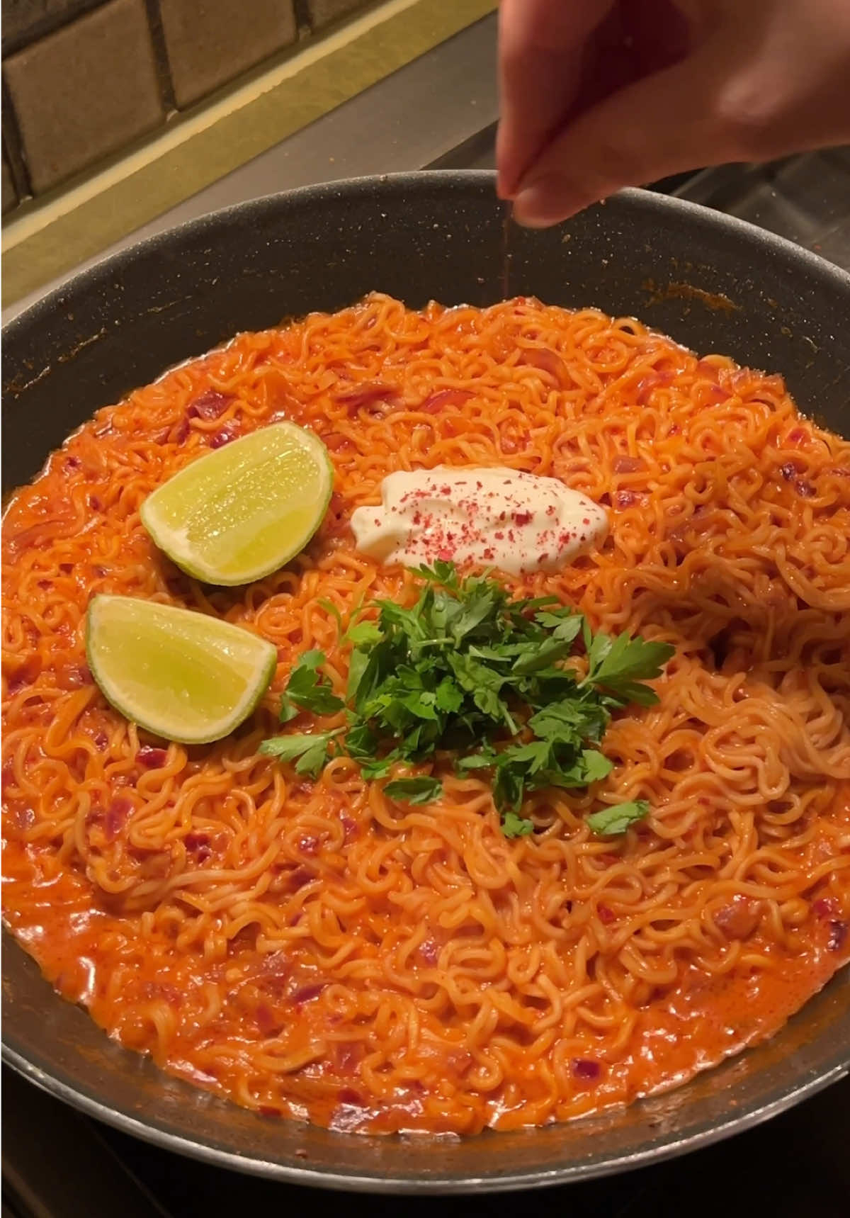 Creamy Spicy Indomie Ingredients: 2 packs Indomie 2 garlic cloves, minced 1 red or white onion, chopped 1 tbsp oil 1 tbsp tomato paste 1 pack Indomie seasoning powder 1 tsp gochugaru 1 tsp garlic powder Salt to taste (if needed) 1 tsp hot sauce (optional) 1 tbsp cream cheese 2 cups hot water Heat oil in a pan over medium heat. Add minced garlic and chopped onion, sauté until fragrant. Stir in tomato paste and cook for about a minute, add the Indomie seasoning powder, gochugaru, garlic powder, and hot sauce (if using). Mix well. Stir in the cream cheese until melted and creamy. Pour in 2 cups of hot water and Add Indomie noodles and let them cook until slightly soft. Let the noodles absorb the flavors, adjust salt if needed, then serve hot.  . . . . . #creamyindomie #asmrfood #asmr #indomie #indomienoodles #chillioil #chillioilnoodles #noodles #latenightcravings #spicy #coldnoodles #ramen #latenightramen🍜 