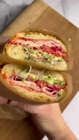 The Ultimate Grinder Sandwich 🥪   The only thing better than a big fat deli sandwich is a big fat deli sandwich on homemade bread! Recipes from my cookbook ‘3 Doughs, 60 Recipes’:  ✨Same-Day Focaccia Dough: page 22 ✨Soft Sandwich Rolls: page 72 ✨The Ultimate Grinder Sandwich: page 175 ✨Pink Pickled Onions: page 90 ✨Garlic Butter: page 146 My same-day focaccia dough and sandwich roll tutorials are pinned at the top of my page here if you need one of these if your life this weekend! 🥪  #sandwichtok #samedayfocaccia #grindersandwich #garlicbread #delisandwich #sandwichrolls #sandwich 