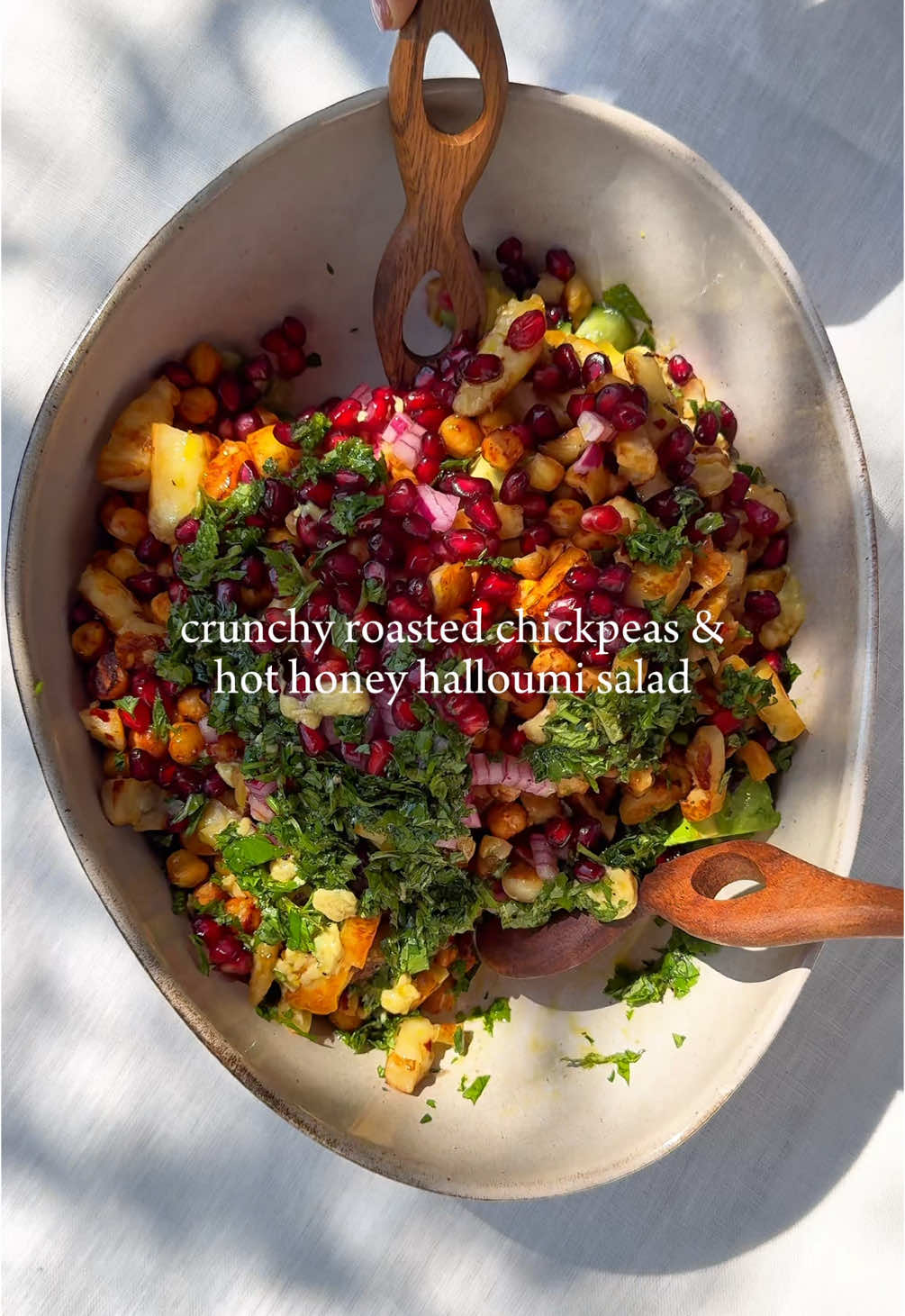 RECIPE👇 INGREDIENTS: This LEAN recipe is one of my current lunch/dinner staples. Packed with a range of micronutrients & abundant in fibre, it has helped me nourish while I heal & get back into shape during postpartum.  CRISPY CHICKPEAS & HOT HONEY HALLOUMI SALAD  For the crispy chickpeas: -400g can chickpeas, drained -1/2 teaspoon sweet paprika or taste -1/2 teaspoon garlic powder or to taste -Sea salt, to taste For the honey halloumi: -1 tablespoon olive oil -250g halloumi, diced -1 tablespoon honey -chilli flakes, to taste Rest of the salad ingredients: -4 handfuls spinach, roughly chopped - 2 cups finely diced cucumber -1 avocado, roughly chopped -1/4 red onion, finely diced, soaked in water (to get rid off the pungent taste) -1/2 cup pomegranate seeds -small bunch mint leaves & parsley sprigs , finely chopped For the dressing: -2 tablespoons EVOO -juice of 1/2 lemon or to taste  -black pepper & sea salt, to taste (be careful with salt as halloumi tends to be salty) -1 teaspoon tahini or to taste -Stevia, to taste (for sweetness/ optional) METHOD: 1. Cover the chickpeas in the sweet paprika & garlic powder, add sea salt to taste. Toss until well covered & bake in the oven or air fryer for 15mins on 200°C  2. Fry the halloumi in a heated non-stick pan until slightly brown, then pour in the honey & sprinkle on the chilli flakes. Fry until a little more golden & crispy. Use medium to high heat! 3. Mix the salad ingredients together. Add the cooled down chickpeas & halloumi, pour the dressing over, mix well & enjoy Extra notes: -You can enjoy this salad as it is, or with crackers/ couscous for more energy. -I stored the salad in the fridge overnight, it tasted lovely the next day. However; halloumi does tend to get tough if not consumed straight away. If you want to avoid that just prep the rest of the salad & add the halloumi fresh before consumption. -Leafy greens tent to get soggy when stored, even though chickpeas soak a lot of water from the rest of the salad in this case. To avoid this add leafy greens before consumption or consume leftover within 24hrs. #hothoneyhalloumi #chickpeasalad #highprotein 