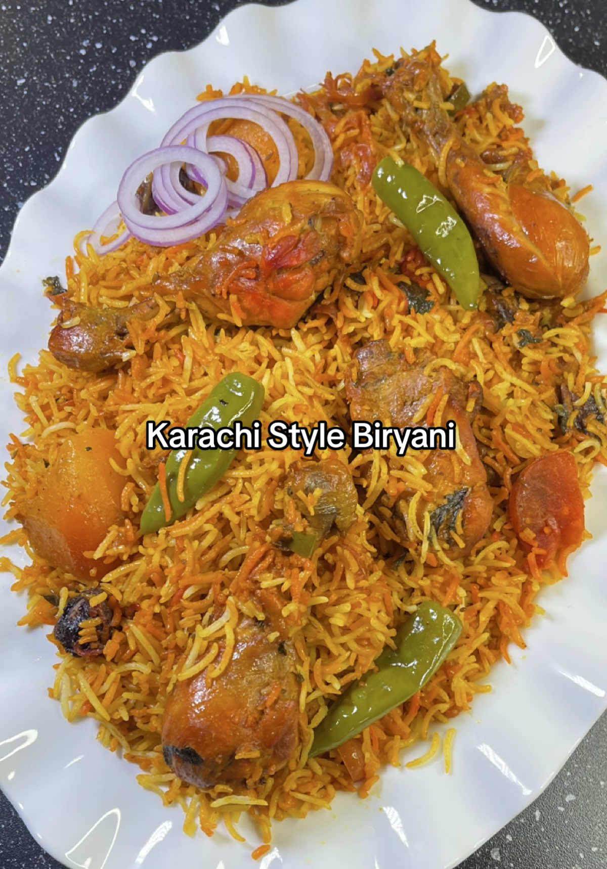 Here's a simple and delicious Karachi-style chicken biryani recipe using LAXMI extra long basmati rice. Ingredients: * 850 g chicken  * 1 tbsp ginger garlic paste  * 1/4 cup oil, 2 tbsp ghee  * 2 medium potatoes  * Salt to taste or 1.5 approx  * 1 tbsp red chilli powder  * 1/2 tsp turmeric powder  * 1 tsp cumin powder  * 1 tsp garam masala powder  * 1/4 tsp nutmeg powder  * 1/4 tsp mace powder  Whole Spices: * 1 tsp cumin seed * 1/4 tsp black cumin seeds  * 6-7 green cardamom  * 5-6 cloves  * 7-8 whole black pepper  * 2 bay leaves  * 2 star anise  * 2 cinnamon sticks  For the rice: * 4 cups basmati rice @LAXMI * 2 tbsp salt  * 1/2 tsp vinegar or lemon juice  * 2 tsp oil Green Masala: * 1/2 cup chopped coriander  * 2 tbsp mint chopped  * 1/2 cup fried onion  * 2 medium tomatoes  * 7-8 dried plum * 7-8 green chillies * 1 tsp chaat masala powder  * 1/2 tsp orange food colour * 1/2 tsp yellow food colour  * 1 tsp kewra water  Final layer: * 2-3 tsp desi ghee  * 1/2 tsp garam masala powder  Instructions: * Prepare Rice: Rinse the rice until the water runs clear. Drain and soak the rice in water for 30 minutes. * Cook the chicken: Heat oil, add chicken, ginger garlic paste and cook for 2-3 minutes on high heat. Add whole and powdered spices. Then add 1 cup of water, potatoes and cook the chicken until 80 % done.  * Bring to a boil 3-4 litres of water, add salt, oil and vinegar. Add soaked rice and cook until 50% is done. * Assemble the Biryani: Spread green masala over the chicken. Add food colour and kewra water. Spread half of the 50 % cooked rice over the chicken. Cover the lid, high heat and cook for 5 minutes. Remove lid and cook on high heat for another 5 minutes. Then add 80% cooked remaining rice followed by desi ghee and some garam masala.  * Dum cooking: Wrap lid with tea towel and cover the pot with some heavy weight and cook over low heat for 10-12 minutes.  * Serve: Turn off the heat and let the biryani rest for 5 minutes. Fluff the rice gently with a spoon and serve hot. What is the best way to enjoy biryani?  #fouryou #trending #Recipe #viral #fyp 