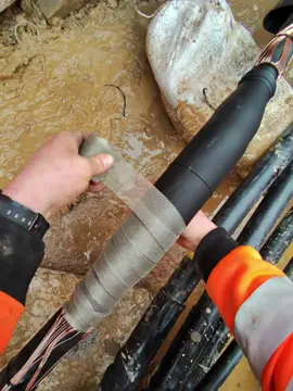 Applying a copper screen mesh tightly around the cold shrink stress control body from one side to the other.  This bonds the two cables semi conductive layers back together.  #electrician #electricians #electricianlife #electriciansofinstagram #electricianslife #electricianproblems #electricianporn #electricianswife #electricianinthemaking #electricianspecialists #electricianshit #electricianstuff #electricianofinstagram #electriciansnightmare #electricianshirt #electricianapprentice #electriciansdoitbetter #electriciansmates #electriciansknow #electriciansdaughter #electricianintraining #led #electronic #engineer #tools #installation #electronics #carpentry #electric #carpenter