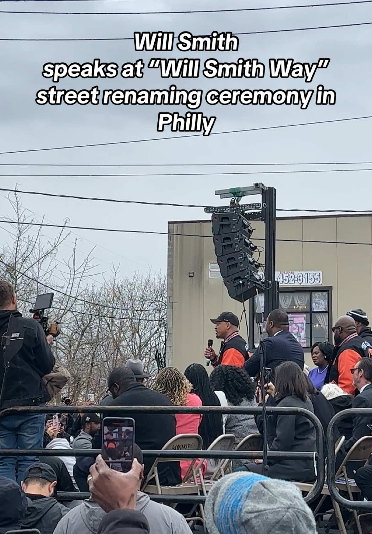 At the ceremony renaming 2000 N 59th St in Wynnefield/Overbrook to “Will Smith Way”, Will took the stage to thank the crowd. He was joined on stage by the mayor, city council, and other Philly radio legends like Lady B and Mimi Brown. Philly Mayor Cherelle Parker also presented @willsmith with a key to the city and asked him to come back for our 4th of July celebration. In his speech, he thanked the city and promised to come back on Independence Day and to reach out to other Philly musicians and entertainers for help. Sidenote: The crowd nearby was a little irritated by the city council members on stage(president Kenyatta Johnson) that kept standing up and blocking their view 😂 #willsmith #philly #keytothecity #streetrenaming #honor #wynnefield #overbrook #overbrookhigh #jazzyjeff #freshprince 