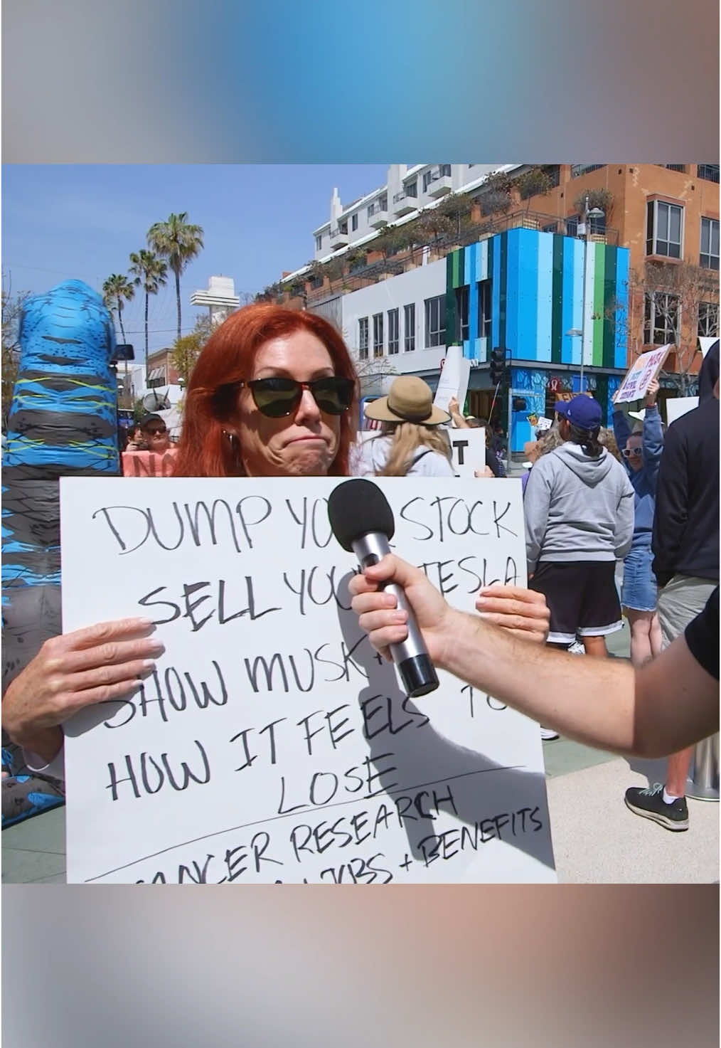At the “Tesla Takedown Day” protest in Santa Monica, California. As protestors shouted “Sell your Tesla!” at passing cars, I couldn’t help but wonder—what’s the person who buys it supposed to do? I asked a woman protester, and she couldn’t really give me a clear answer. She did mention her First Amendment right to protest, though. What do you think? #news #politics #interview 