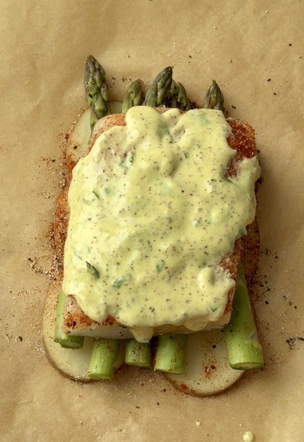 Parchment Paper Cod & Veggies✨ This recipe is heart healthy, full of flavor, & super nutritious! Feel free to layer more potatoes to liking! Just make sure they’re super thin so they cook quicker. (Recipe below & follow @thehealthyhophead for more easy & nutritious recipes!) Recipe: Ingredients- 1 cod fillet  Handful of asparagus 1 small potato (cut into super thin slices) Garlic powder to liking Onion powder to liking Paprika to liking  Salt/pepper to liking Chopped parsley for garnish Parmesan for garnish  Sauce- 1 tbsp olive oil 1 1/2 tsp lemon juice  1 tbsp mayo 1/2 tbsp spicy Dijon mustard 1 tbsp chopped parsley Pinch of salt Directions-  1. To one side of the parchment paper, layer the potato slices, asparagus, & fish in that order. Then season with the seasonings listed above to liking. 2. Set aside & assemble to sauce my adding all the ingredients inter “sauce” to a small bowl, & mixing until well combined. 3. Drizzle the sauce over the fish, then fold the parchment paper over the fish & doggies as seen in the video.  4. Air fry at 350F for 20-25 minutes or until the fish is thoroughly cooked & the potatoes & asparagus is tender. You can also bake at 375F for 25 minutes or until the fish is cooked throughly & the potatoes & asparagus is tender.  5. Top with parsley & Parmesan & enjoy! #food #foodtiktok 